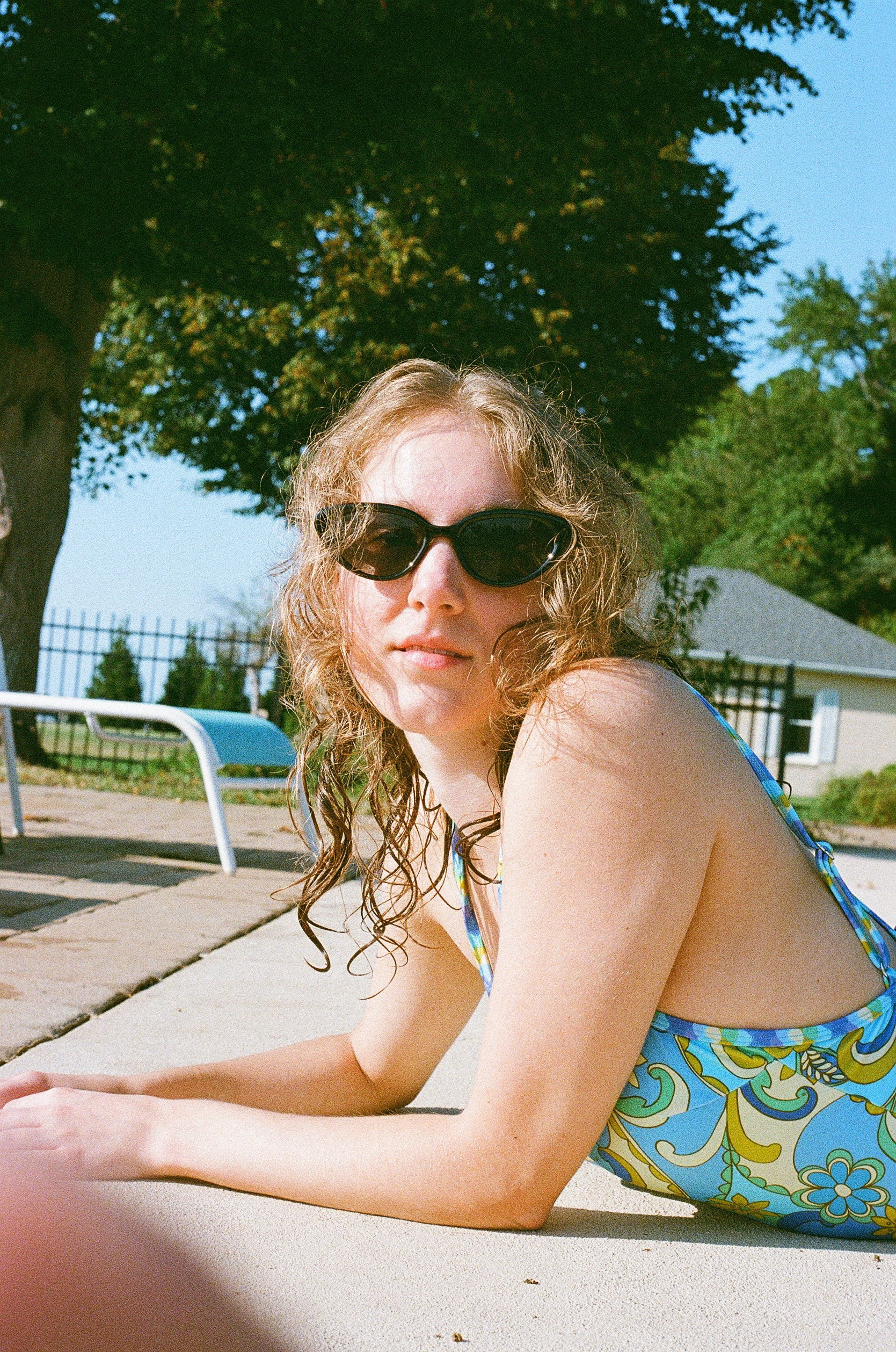 Erin Heim poses by a pool in the heat of July, shot on 35mm film.