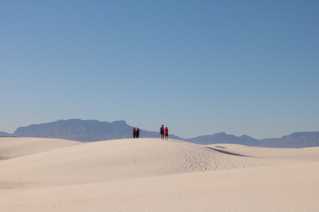 Individuals visiting White Sands National Park in Las Cruces, New Mexico on January 30, 2023.