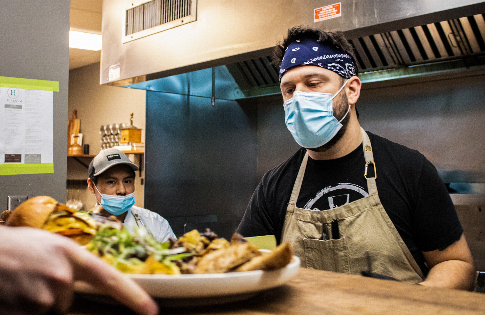 Chef Tim Pervizi and his sous chef Ernesto prepare food on their first day returning to indoor dining at Heirloom in Doylestown on Feb. 10, 2021. 