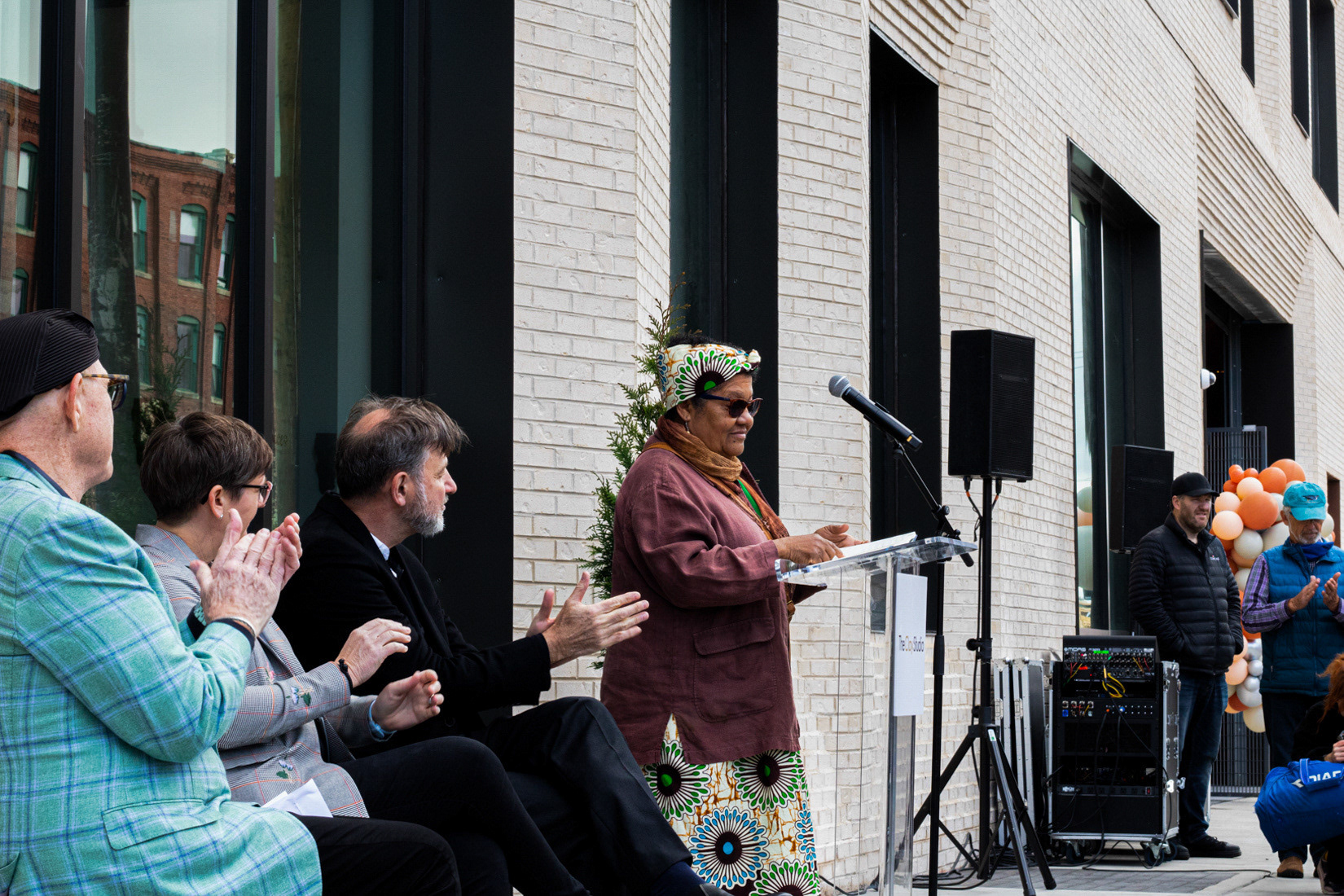 Iris Brown, a resident of the South Kensington community since 1977, speaks at The Clay Studio grand opening on April 9.  