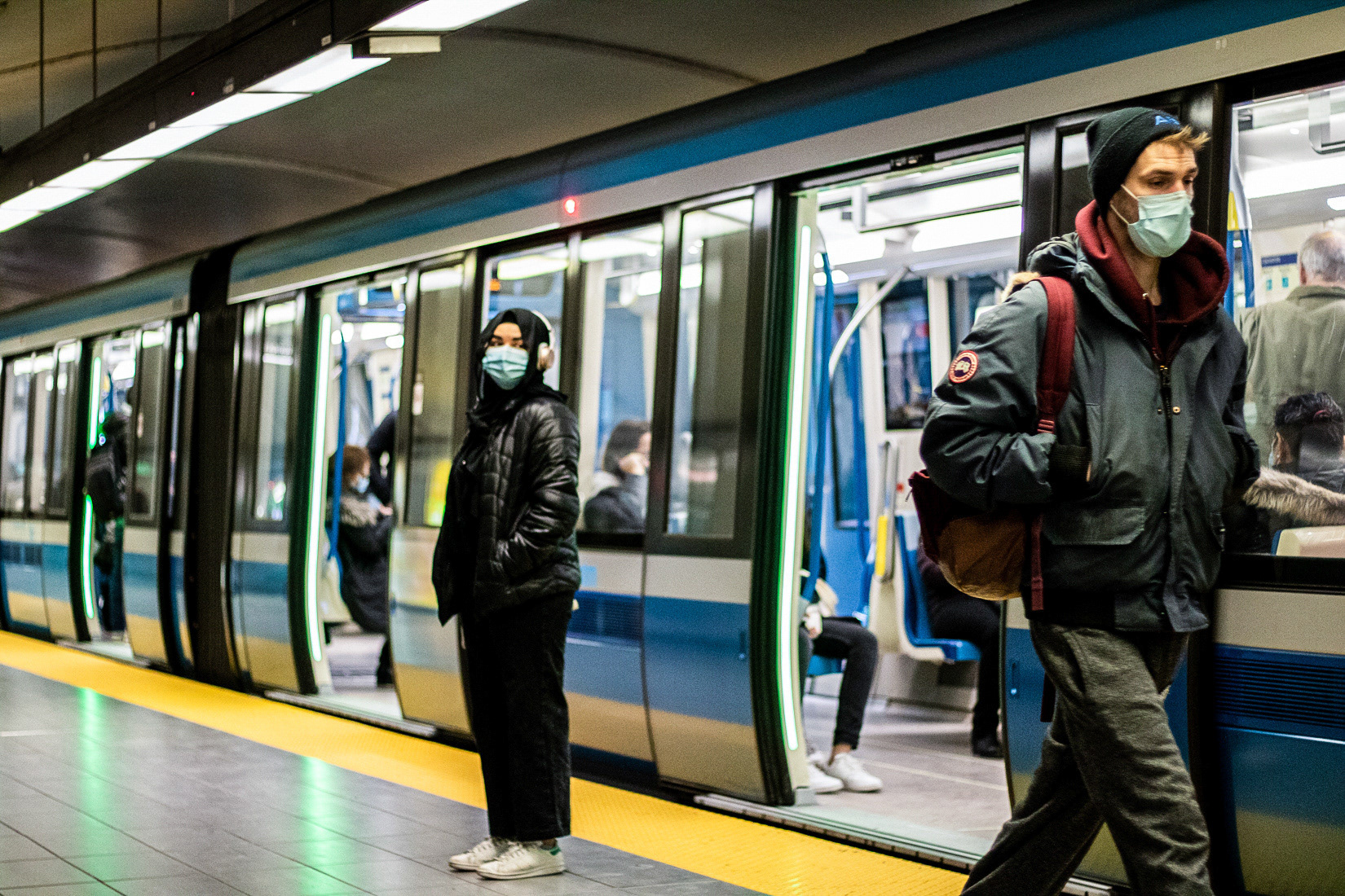 An individual stands outside of the metro at Concordia University metro station in Montreal on April 1. 