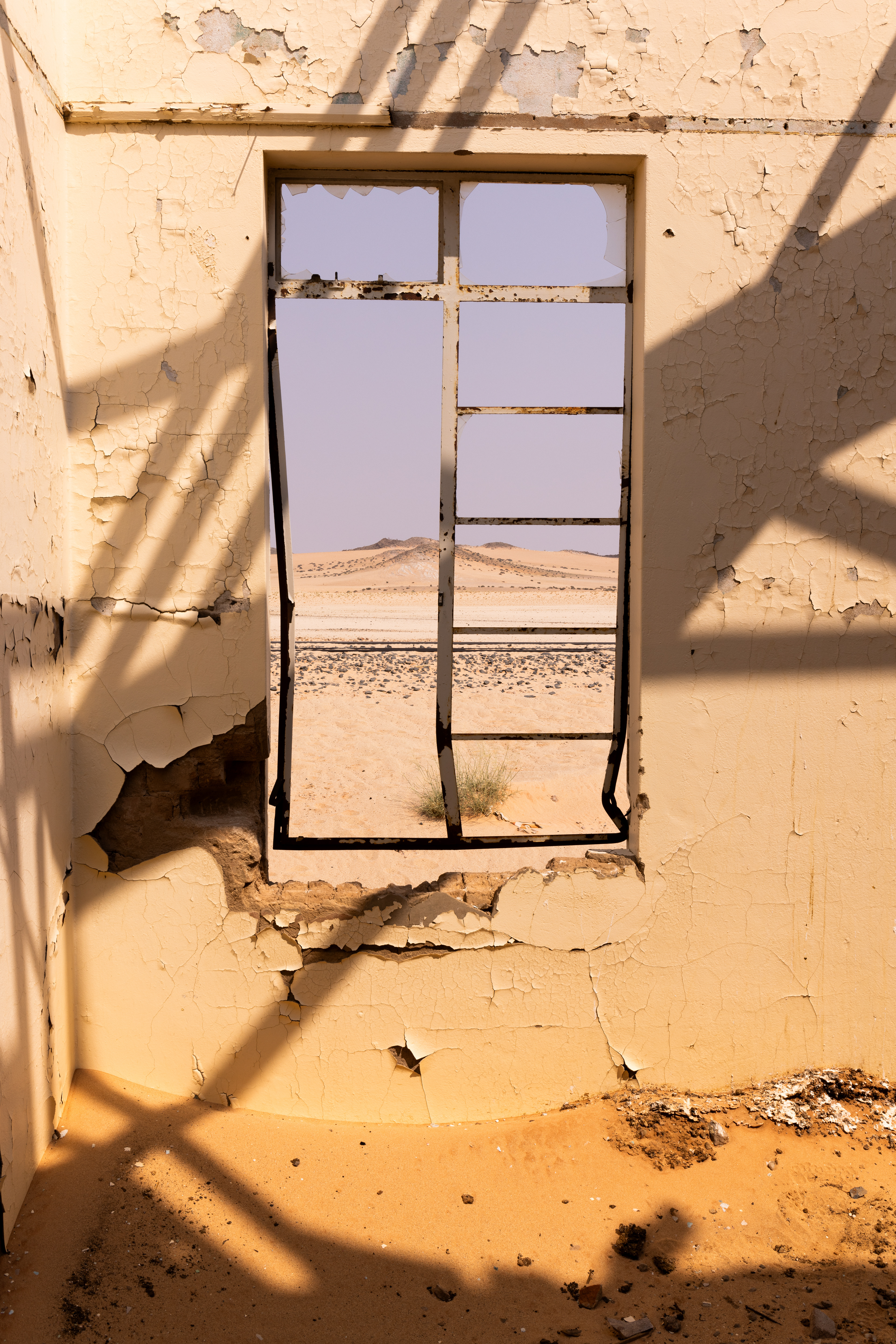 Garub Railway Station III - The broken roof casts interesting shadows in the bright sun. Garub, Namibia.