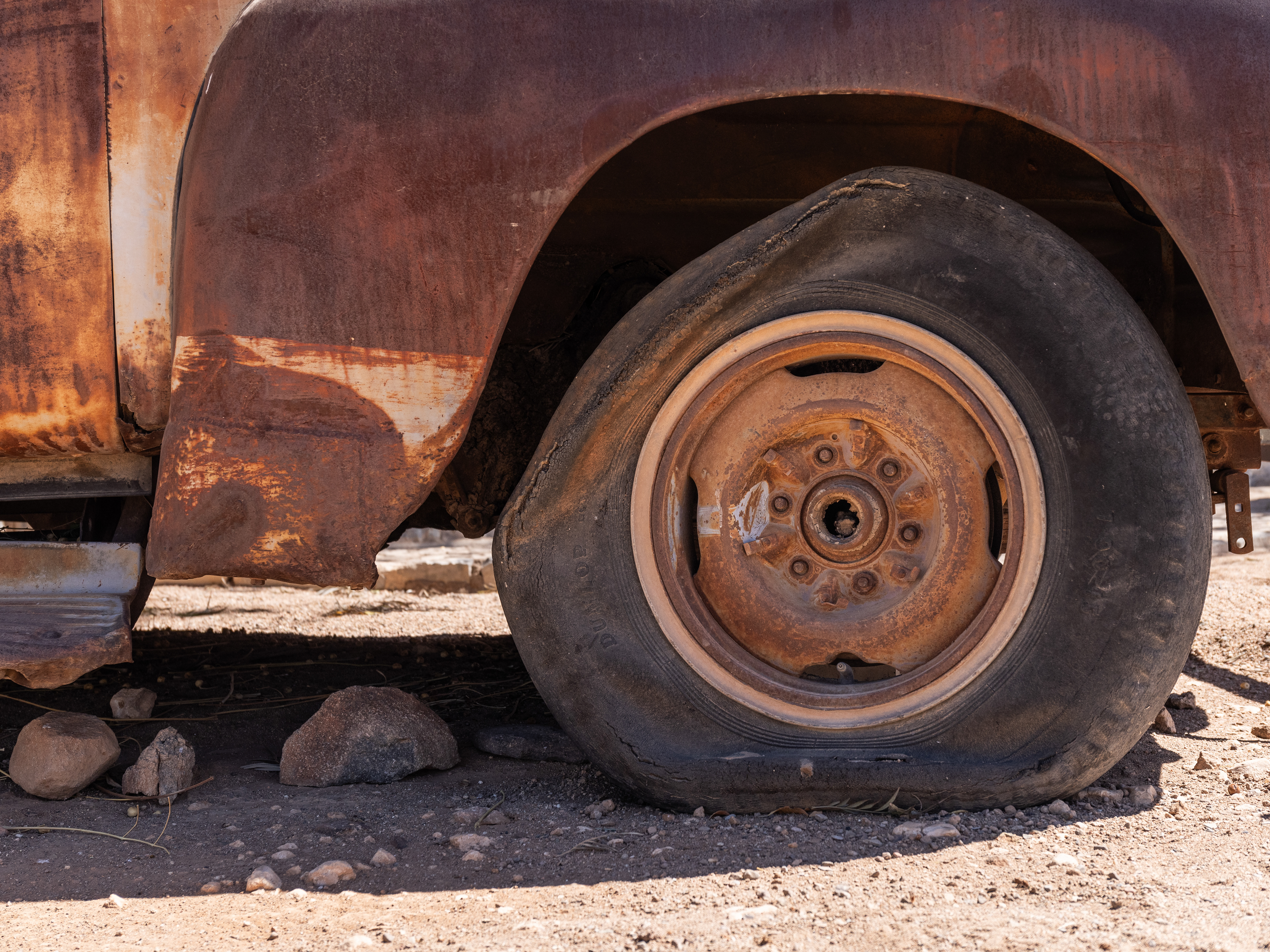 Flat Tyre - Helmeringshausen boasts its own collection of abandoned and derelict cars. Helmeringshausen, Namibia.