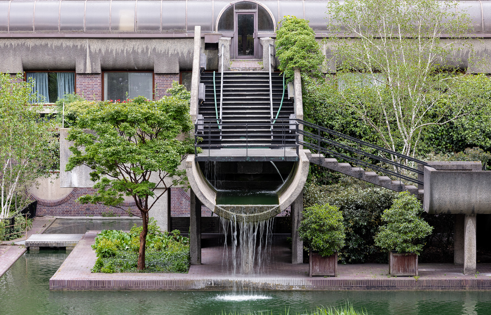 Futuristic City. Something about the mix of concrete structure and green trees, spoke of a futuristic city. Barbican, London.
