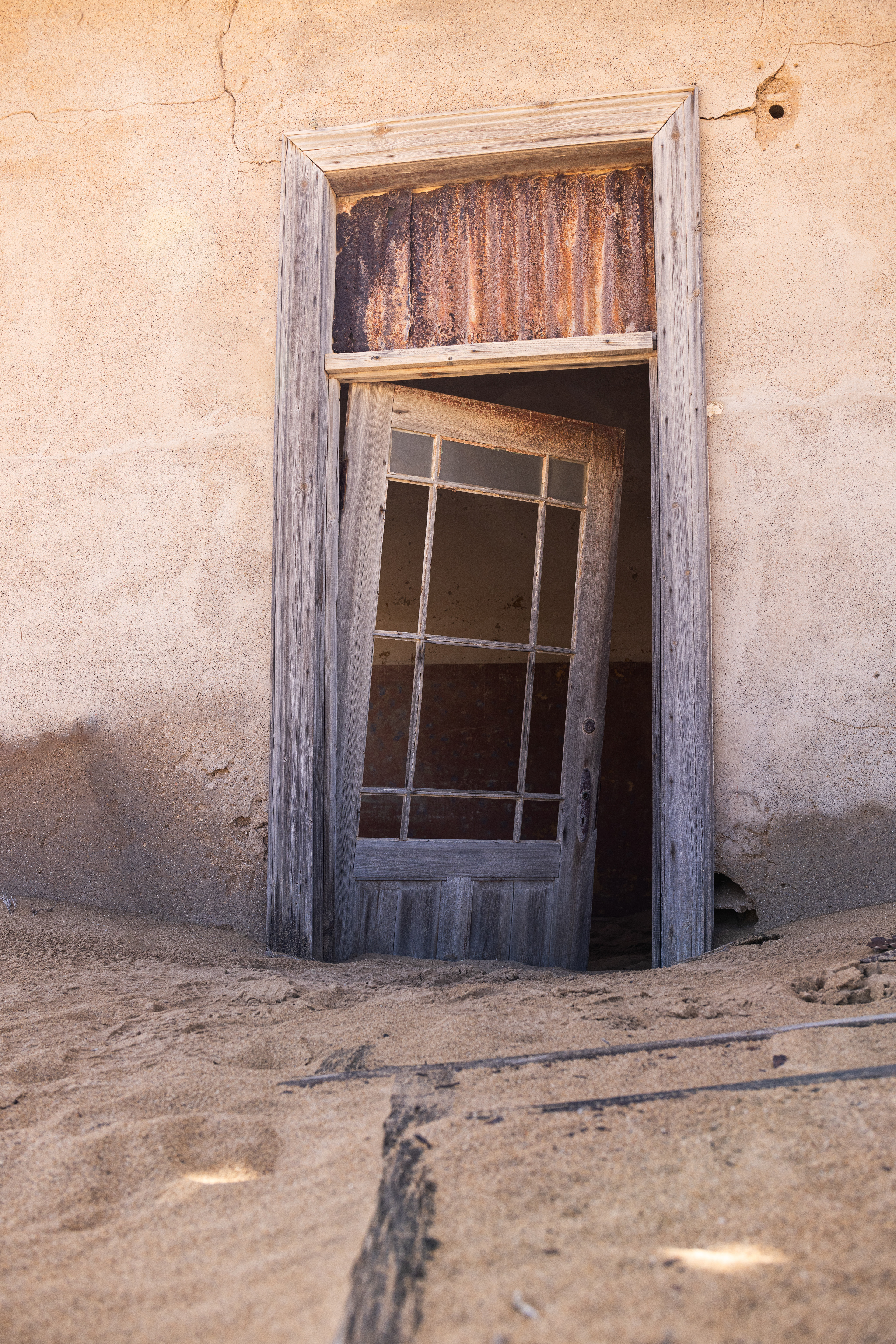 Kolmanskop V - With its final abandonement in 1956, the desert set about reclaiming its territory. Kolmanskop, Namibia.