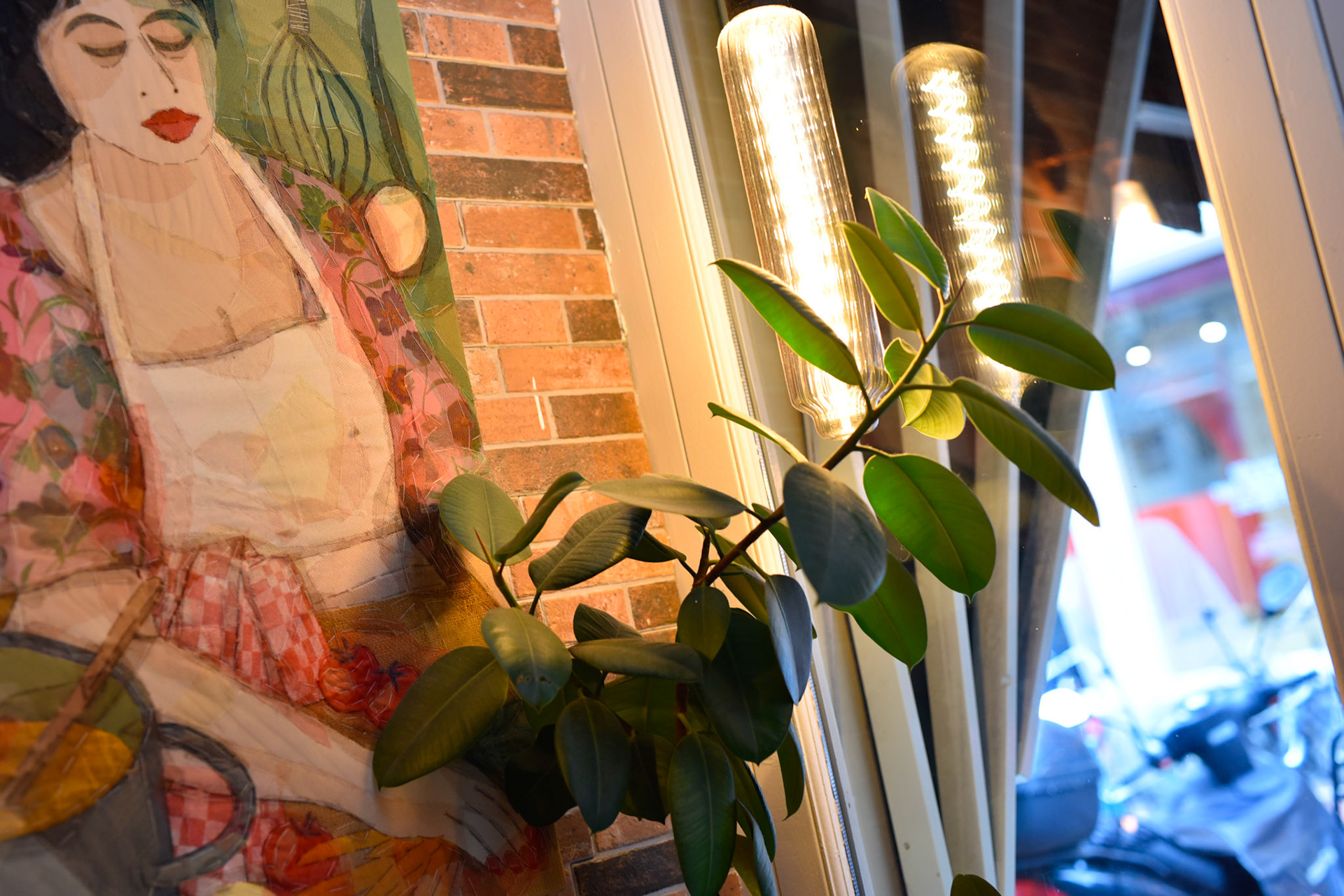 inside Brunchie restaurant where I had 4 ginger shots, sweet art, cozy, plants