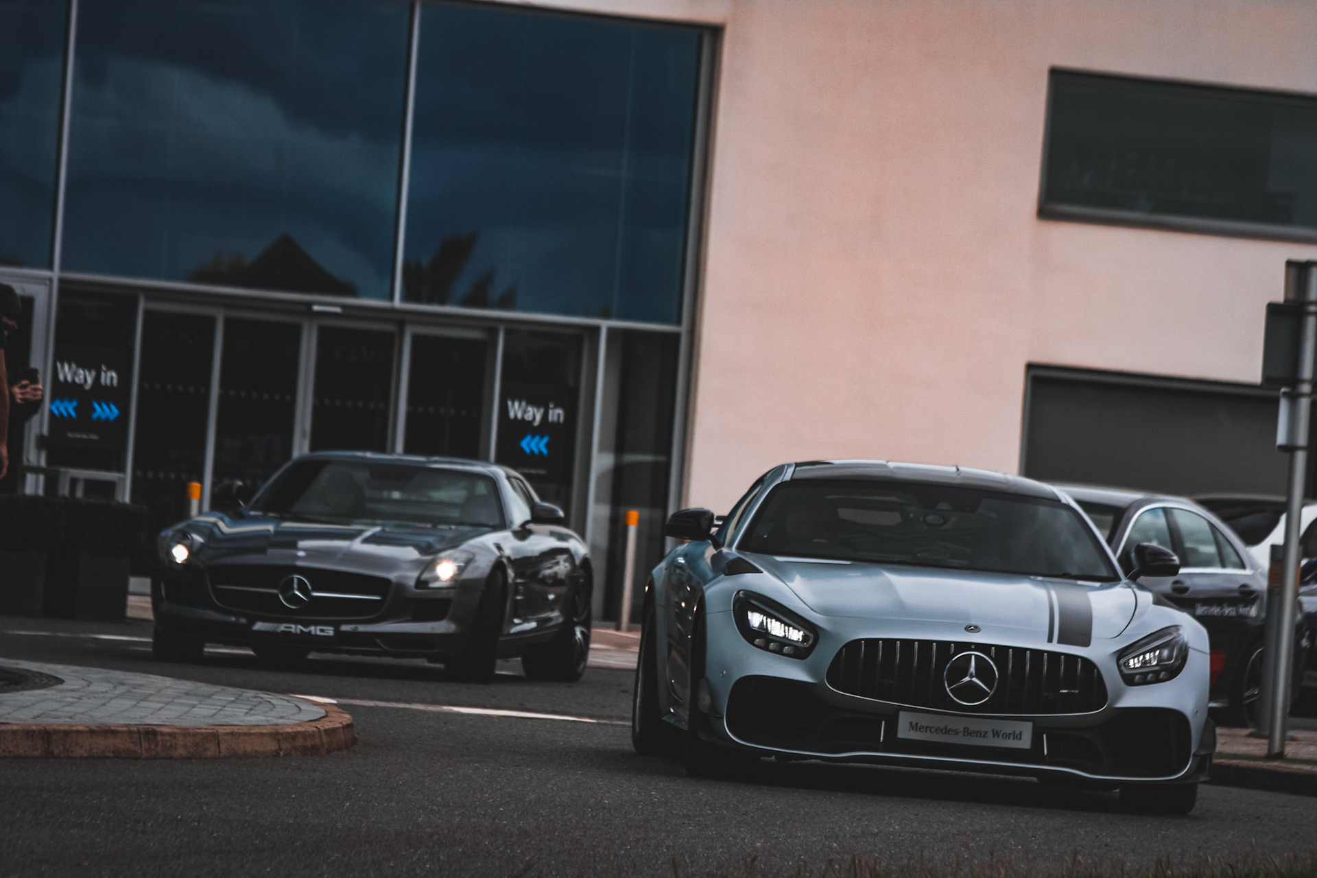 Past and present collide – the legendary SLS AMG meets its spiritual successor, the AMG GT R, outside Mercedes-Benz World.