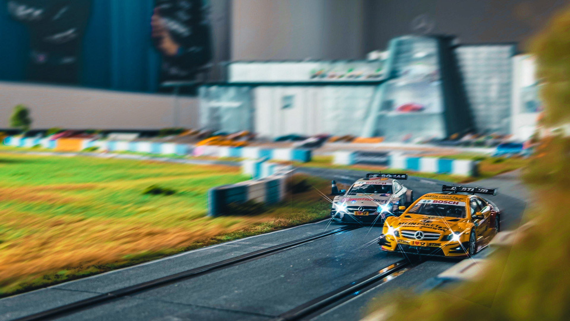 Tiny titans at full tilt – DTM icons locked in battle on a scale that’s anything but small.