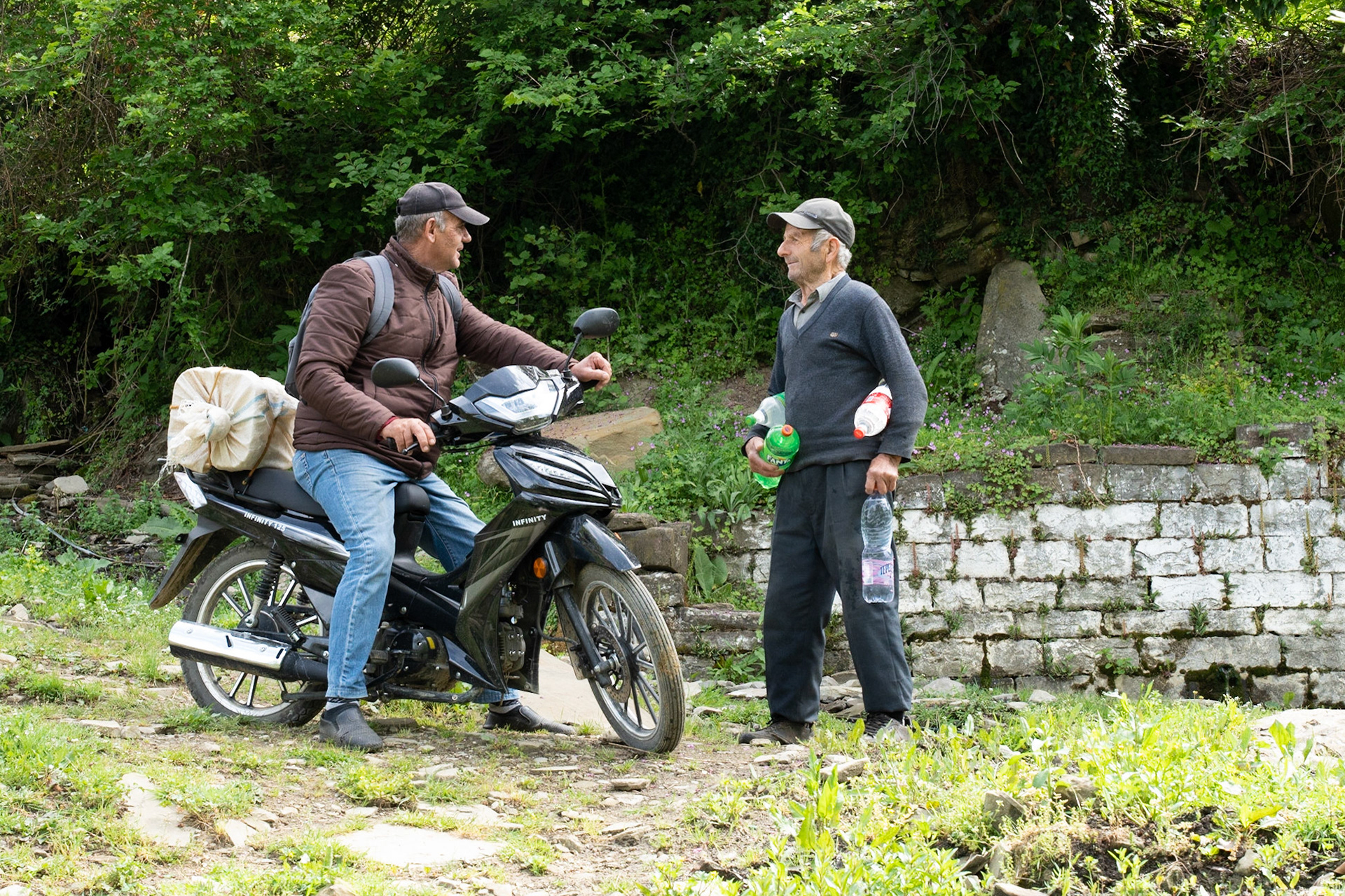 Filling water bottles at Leskaj drinking fountain