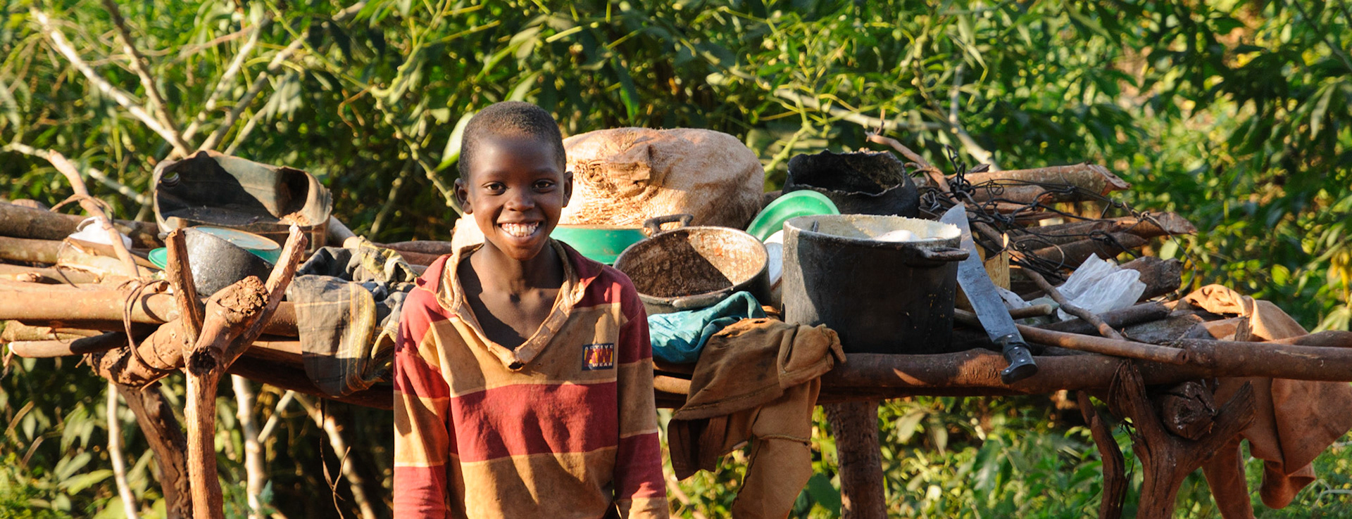 Boy in front of kitchen tools