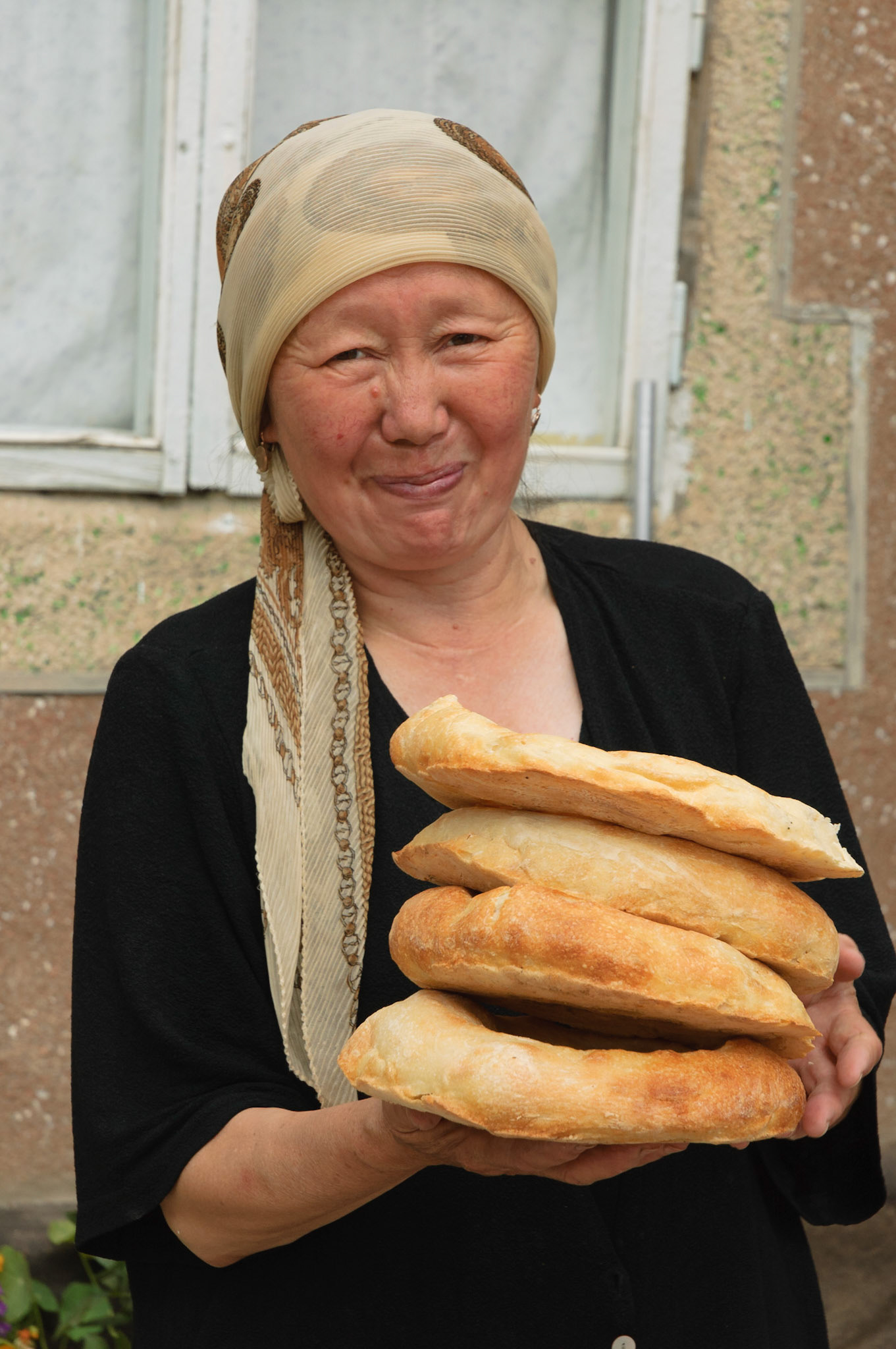 homestay host  making fresh bread, Kochkor