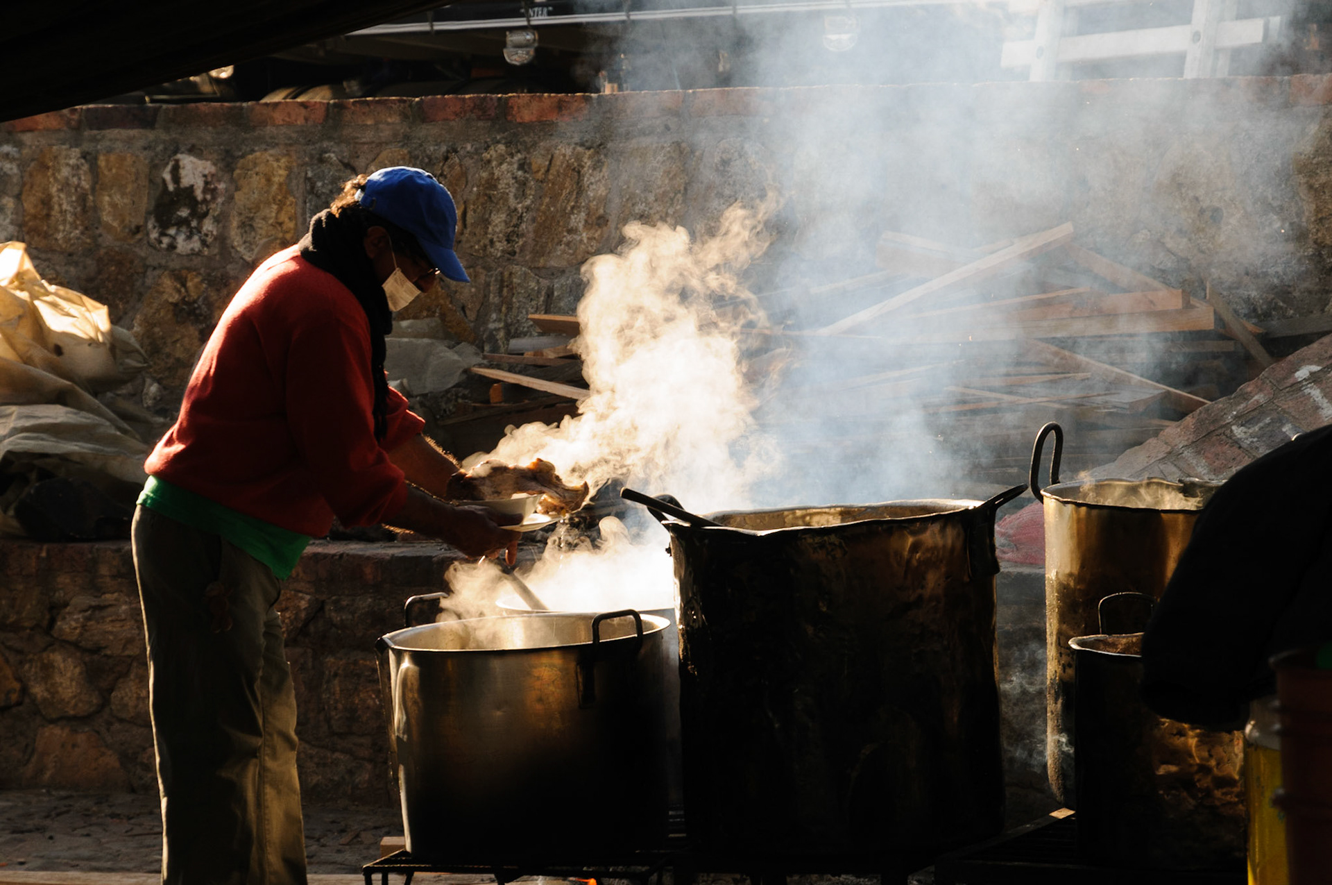 Cooking in huge sauce pans at the food market, Villa de Leyva