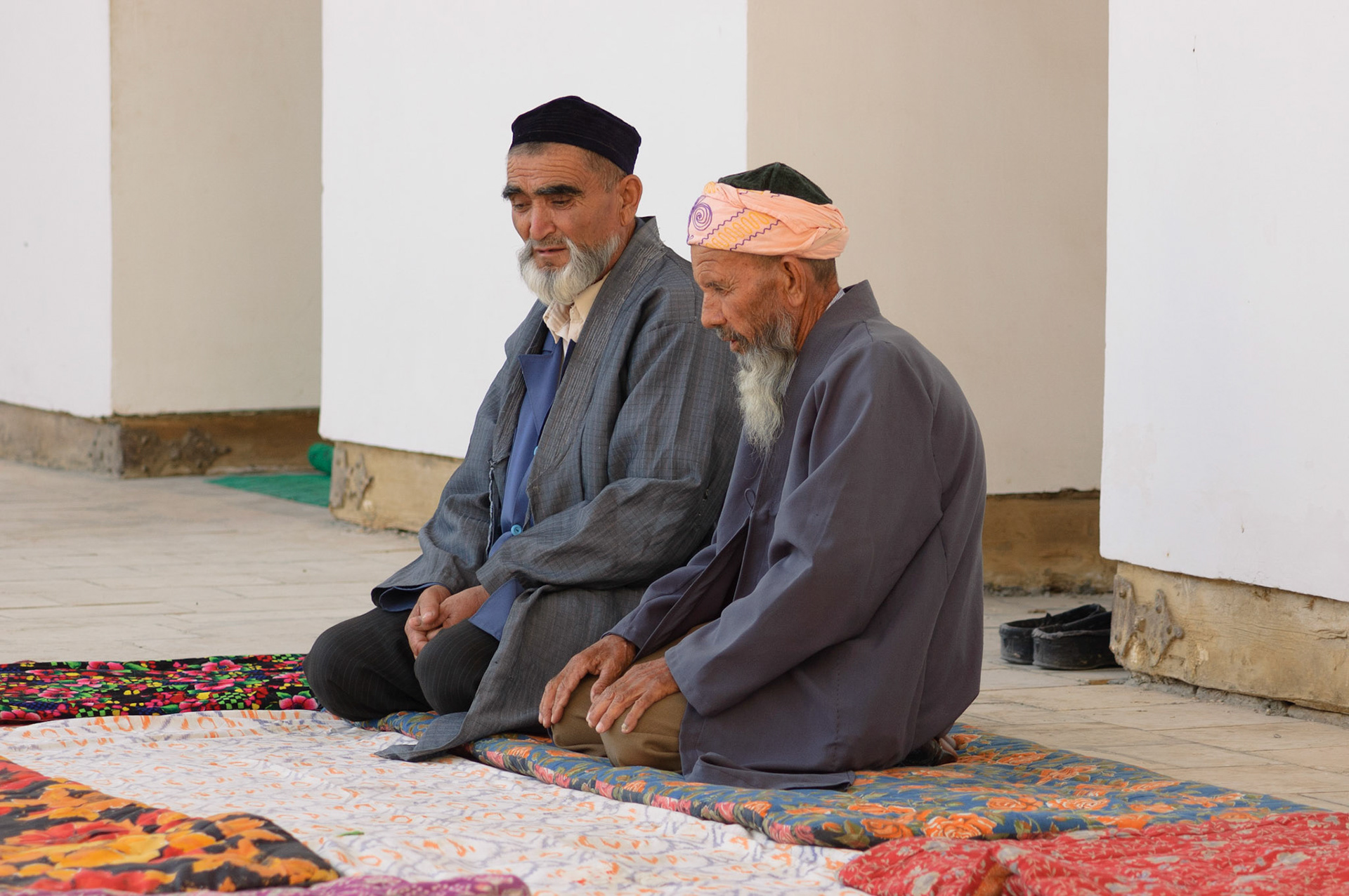 praying moslims in Bakhautdin Naqshband Mausoleum, Bukhara