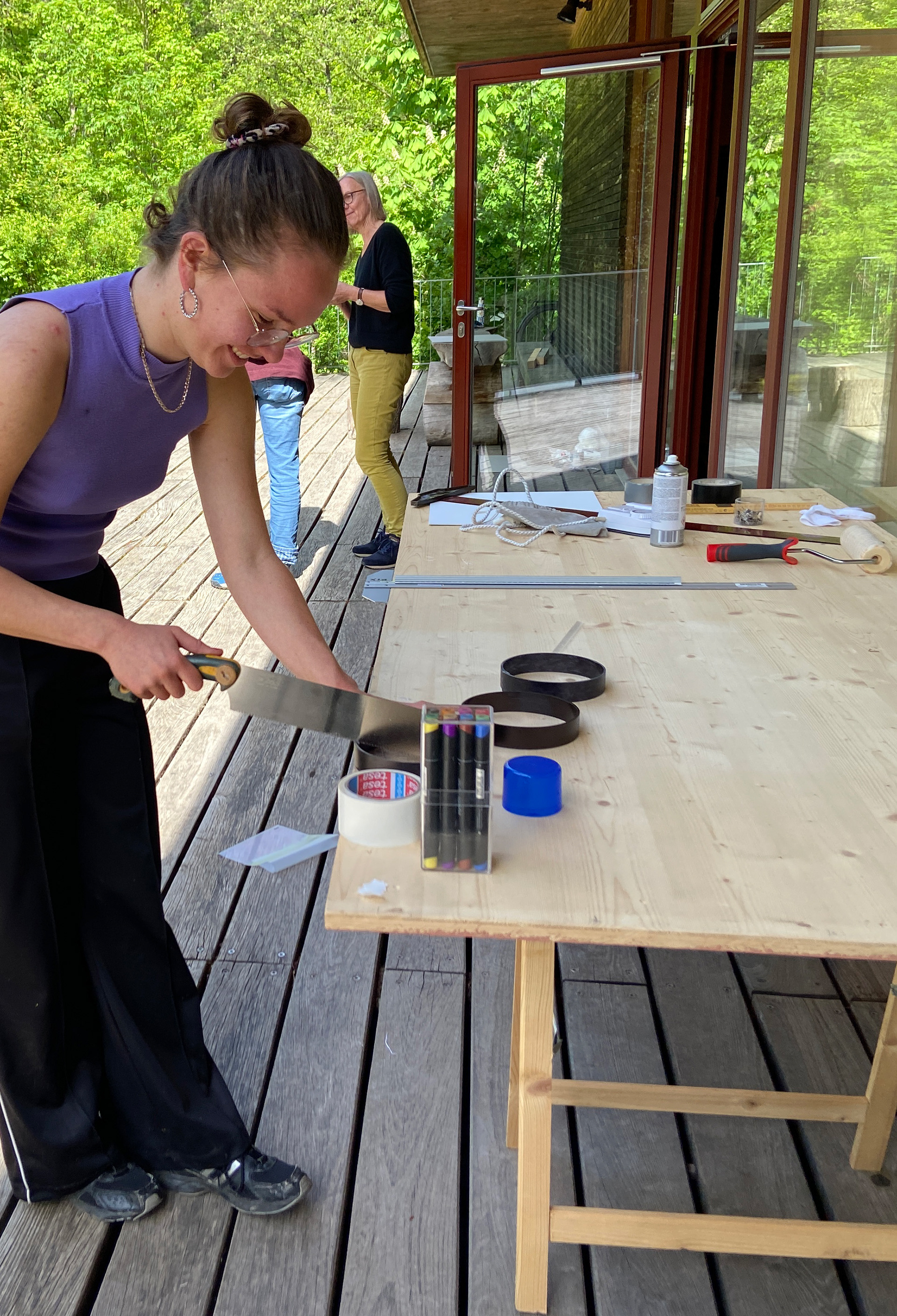 Working on a sculpture outside the gallery