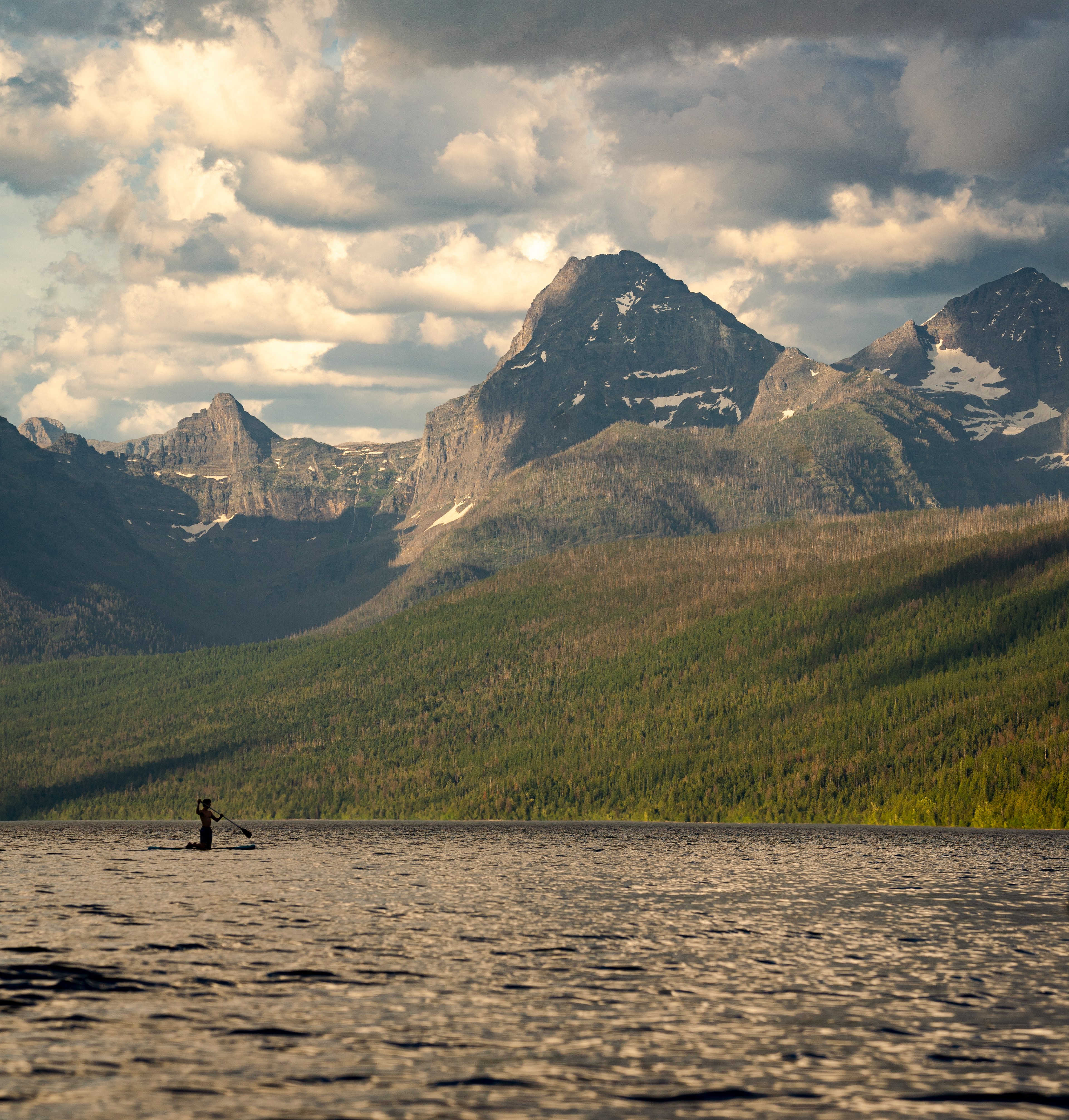 One lone soul takes on Lake McDonald at sunset in hopes of catching the beginning of the sunset. Glacier National Park
