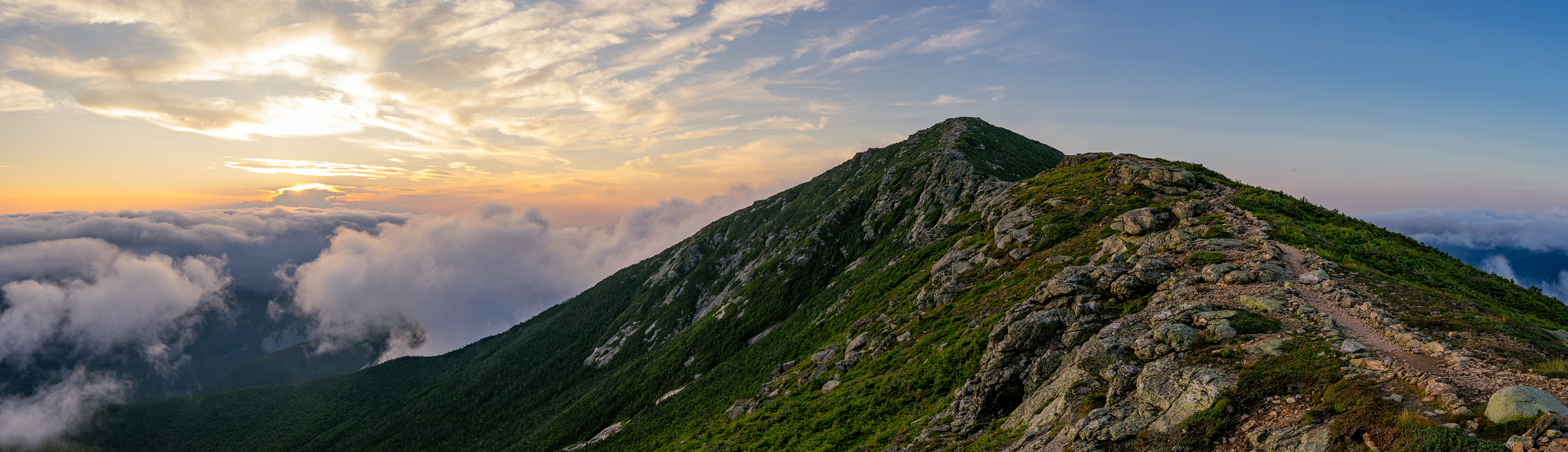 Clouds dispersing as the sun sets over New Hampshire