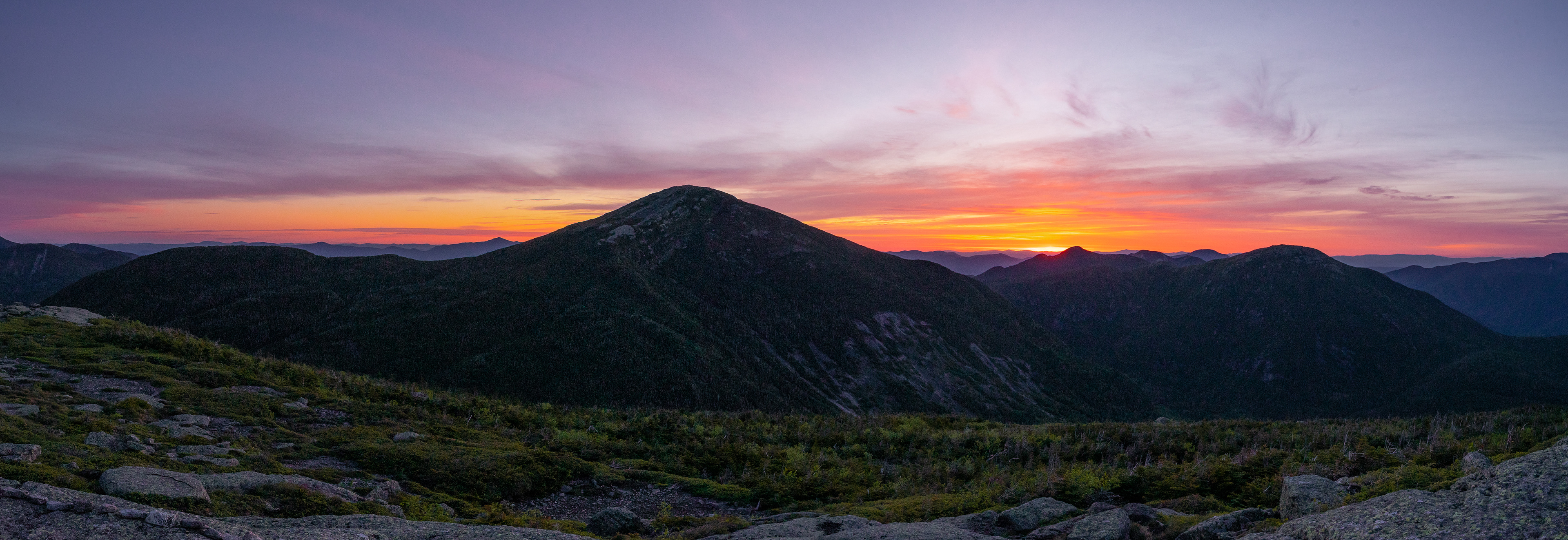 A view worth the world. It's an unreal experience to stand on top of a Adirondack High Peak as the sun rises above the horizon. Mt. Skylight, New York