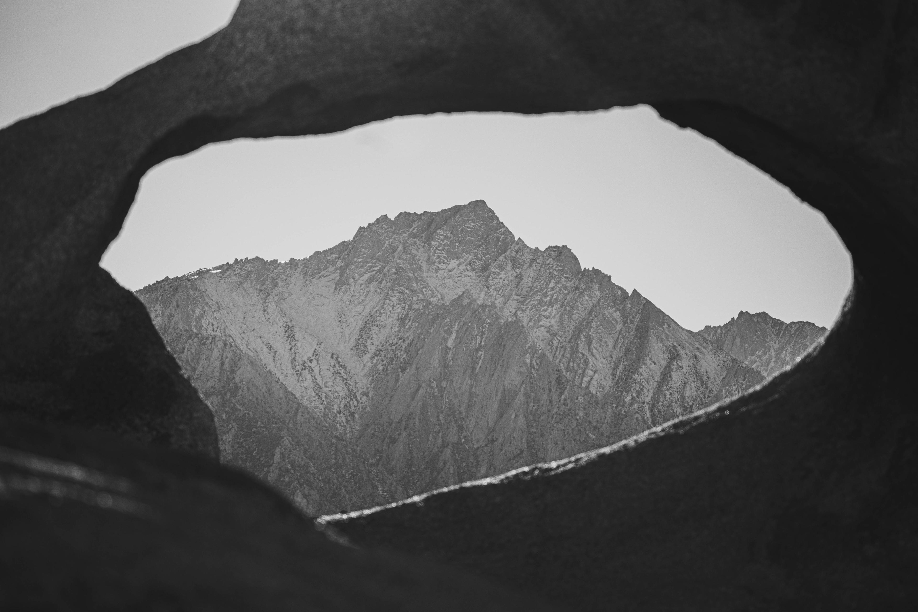 A great view of Lone Pine Peak through a rounded rock structure. Alabama Hills, California