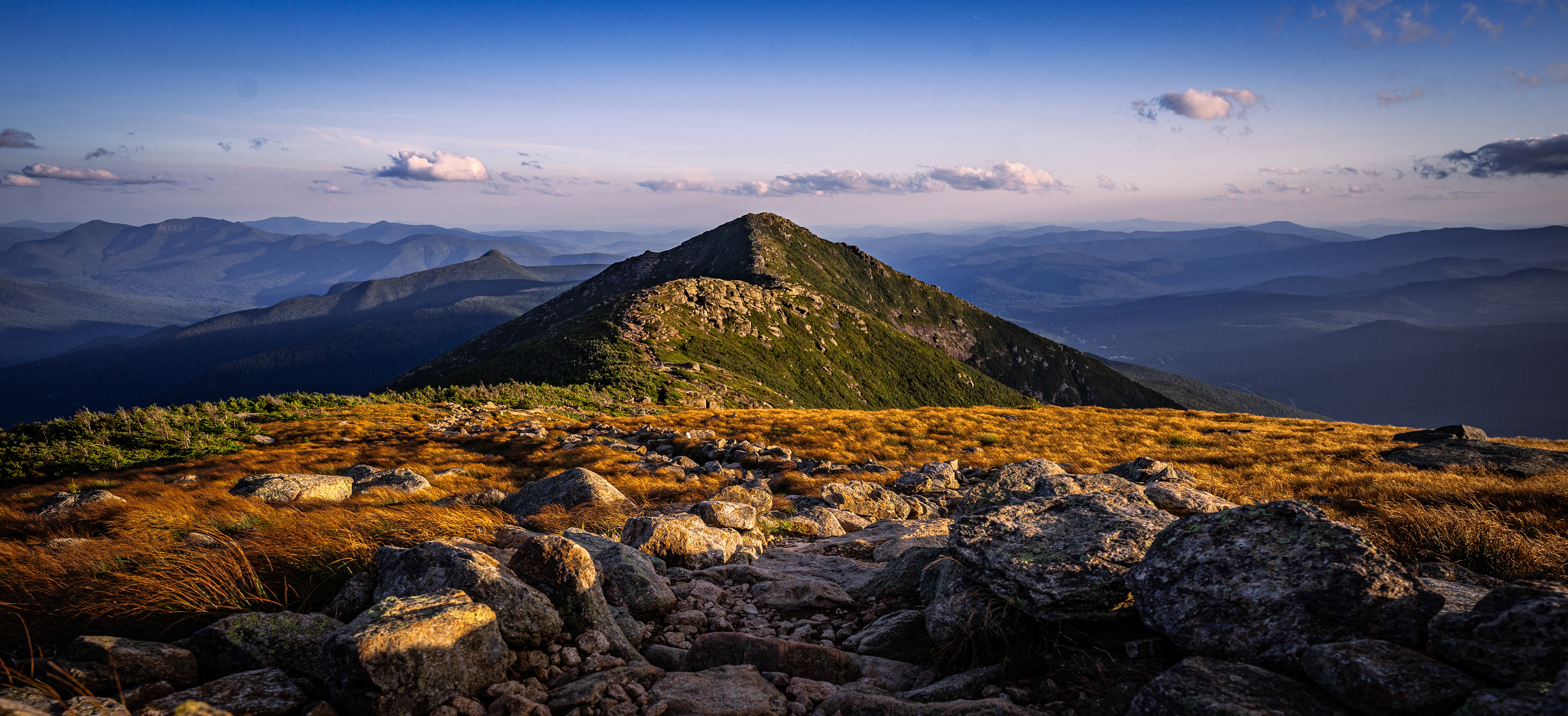 Sun sets across an alpine meadow on top of Mt Lafayette. Franconia Ridge Trail, New Hampshire
