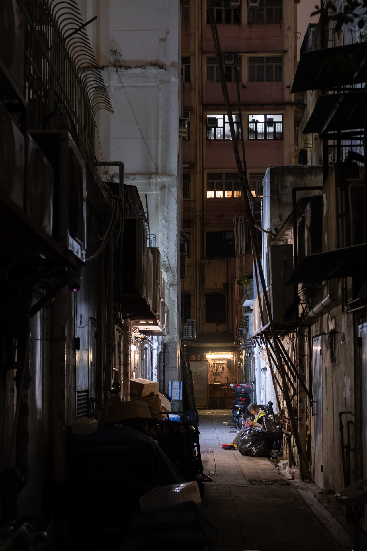 Worker in Night Alleyways
