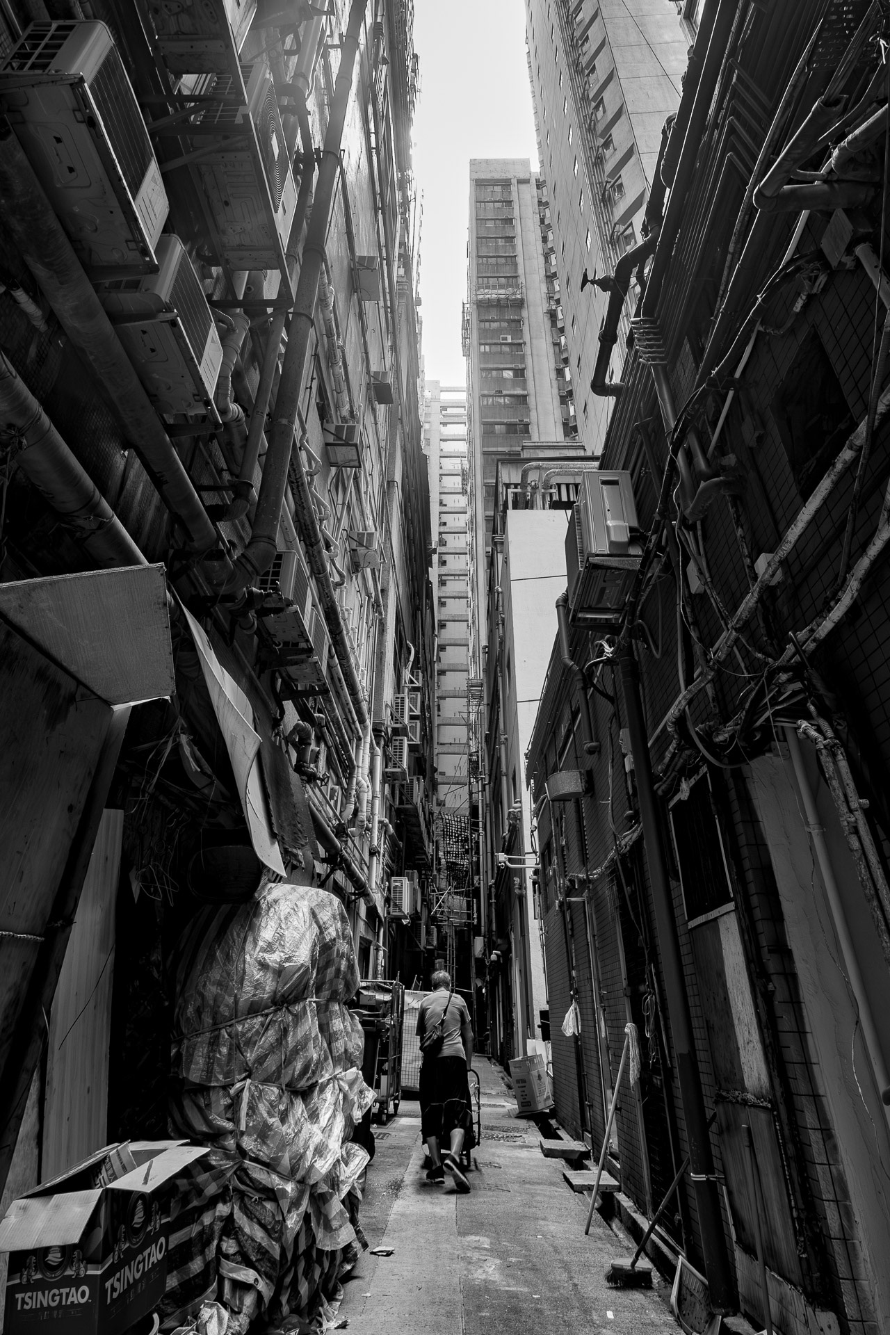 Back alley with pedestrians in Hong Kong during the day