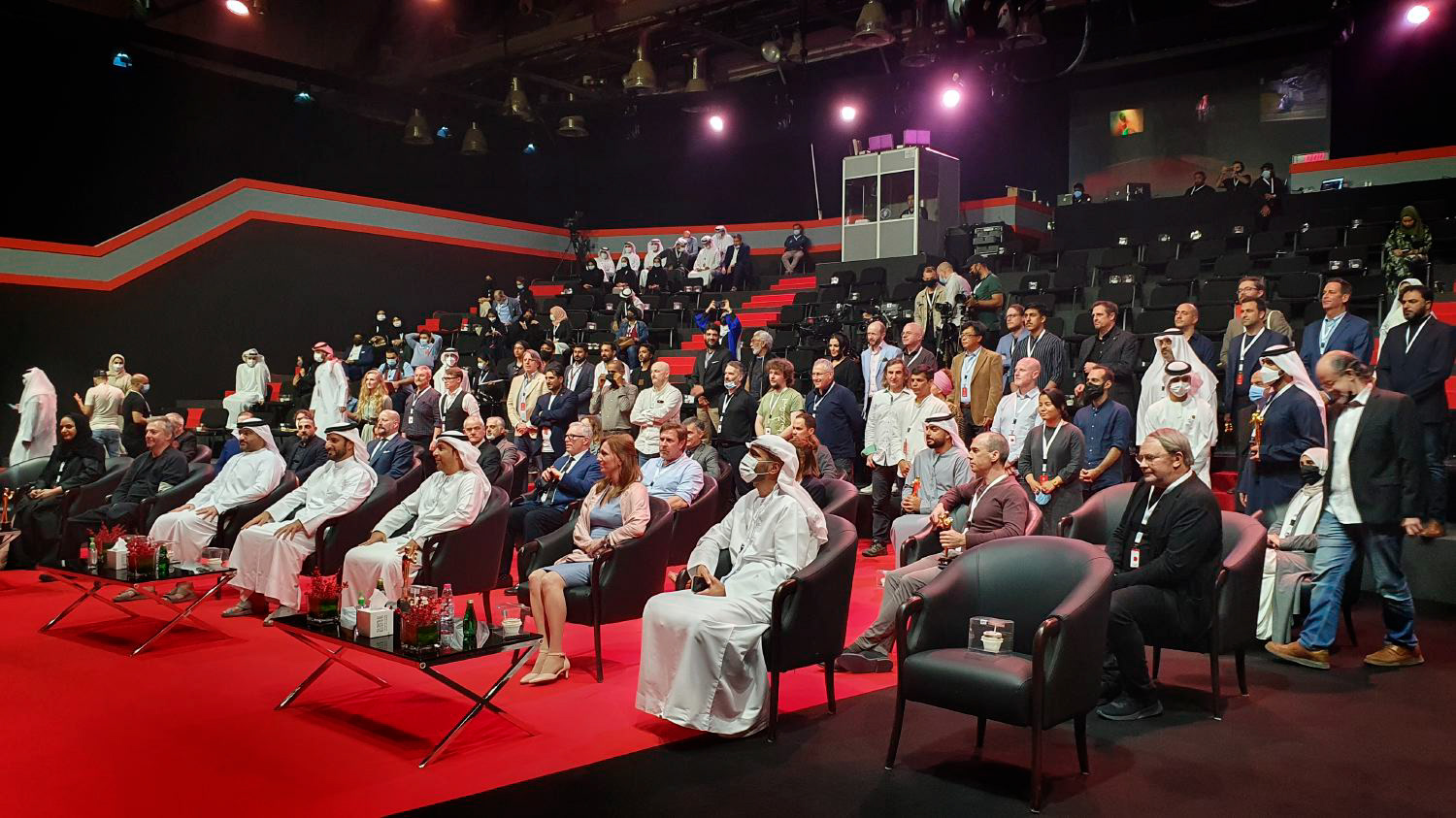 All the photographers posing for the photo with the Sheikh in the foreground