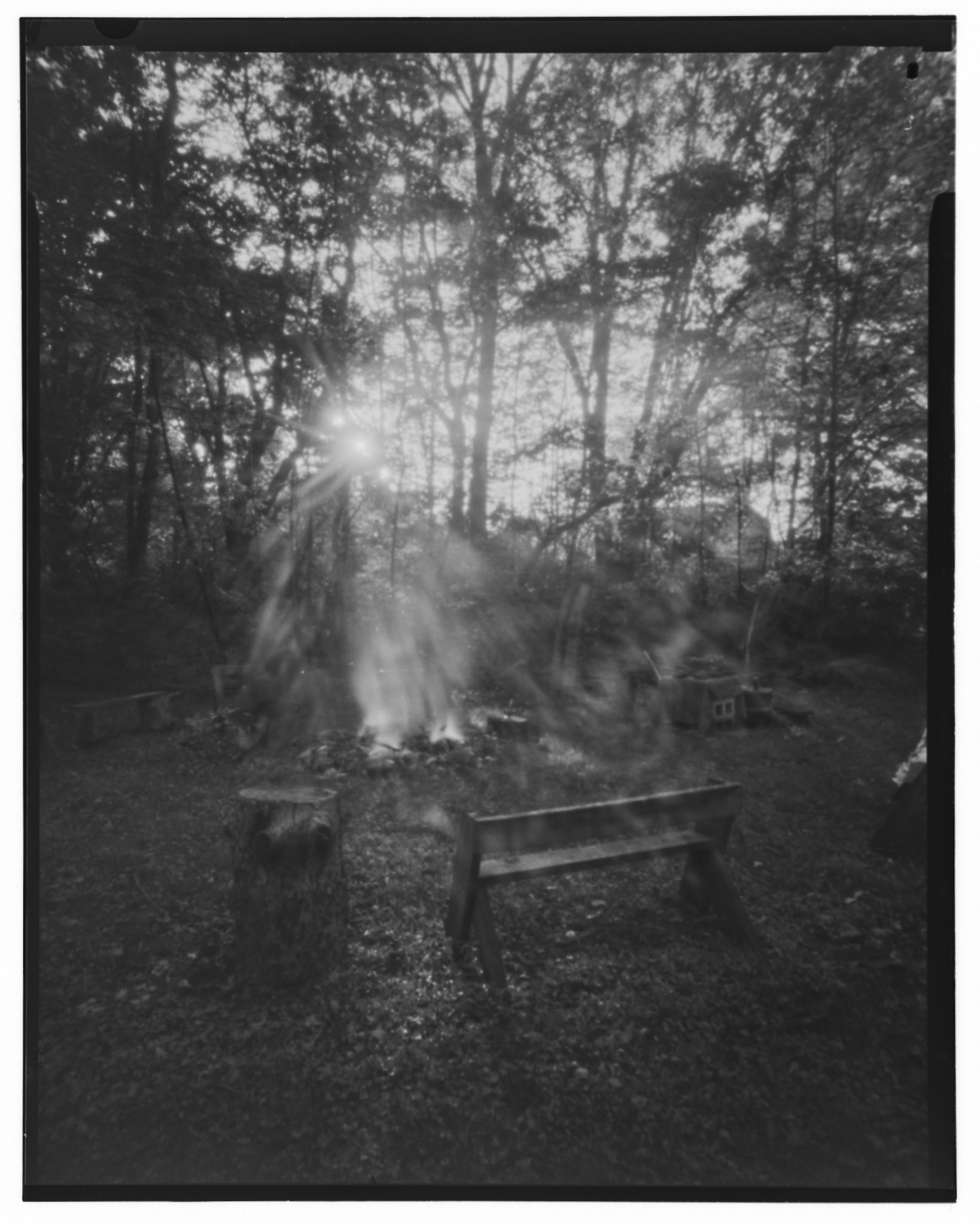 Offerings to Belenos made at three fires: a Fire of Community, a Fire of Inspiration, and a Fire of Sacrifice. The sun broke through the trees during the rite, flooding the space, while we moved about making our offerings. The only vaguely solid figure in the image is the Priest, standing with his stole defined but body ephemeral in the space. f/231, 75mm, 30min. Arista EDU Ultra 100 B+W 4x5 film