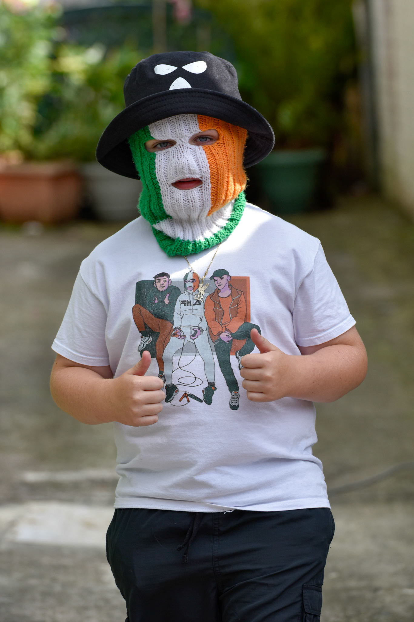 Kneecap at the unveiling ceremony of a new mural at:Hawthorn Bar West Belfast,Friday 9th August 2024.The three members of the band mingled with spectators.