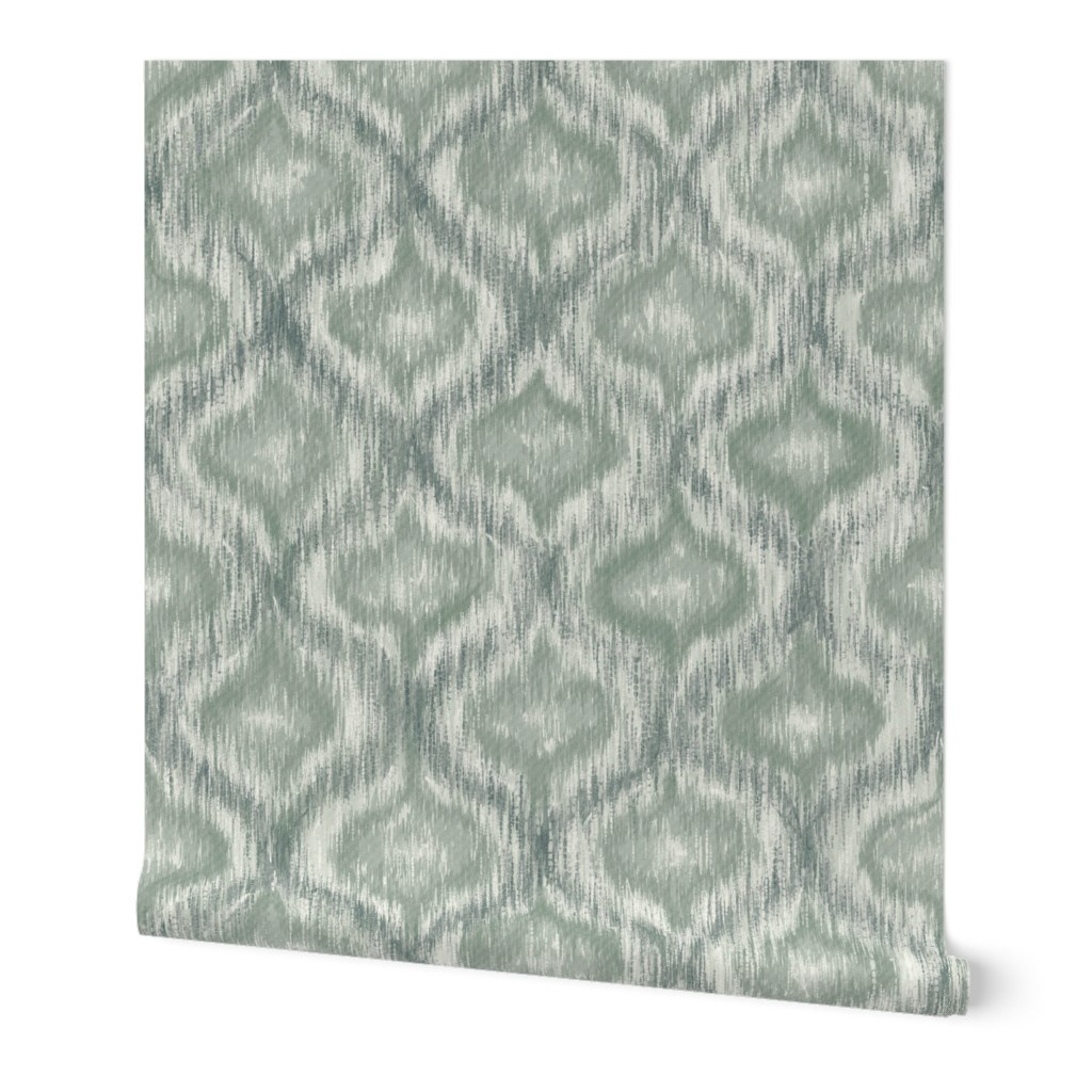Flat allover pattern swatch of dusty teal ikat ogee wallpaper with soft diffused edges and subtle tonal variation across the ogee repeat