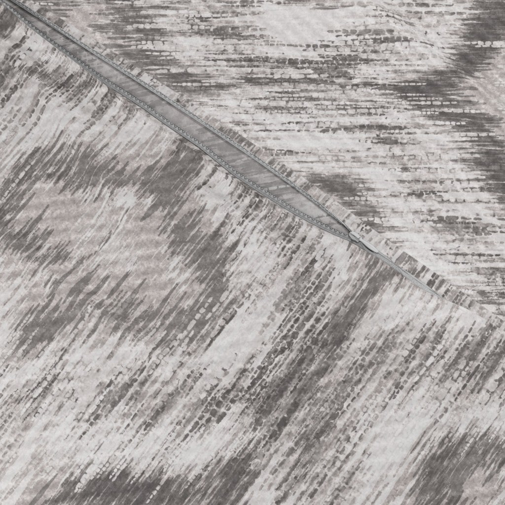 Close-up texture detail of Boho Style Ikat Ogee fabric in soft grey showing soft diffused ikat edges