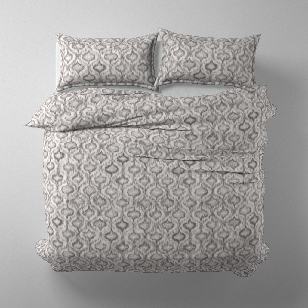 Duvet cover and pillow set mockup in Boho Style Ikat Ogee soft grey colourway on a styled bed, by Lemon Dessin