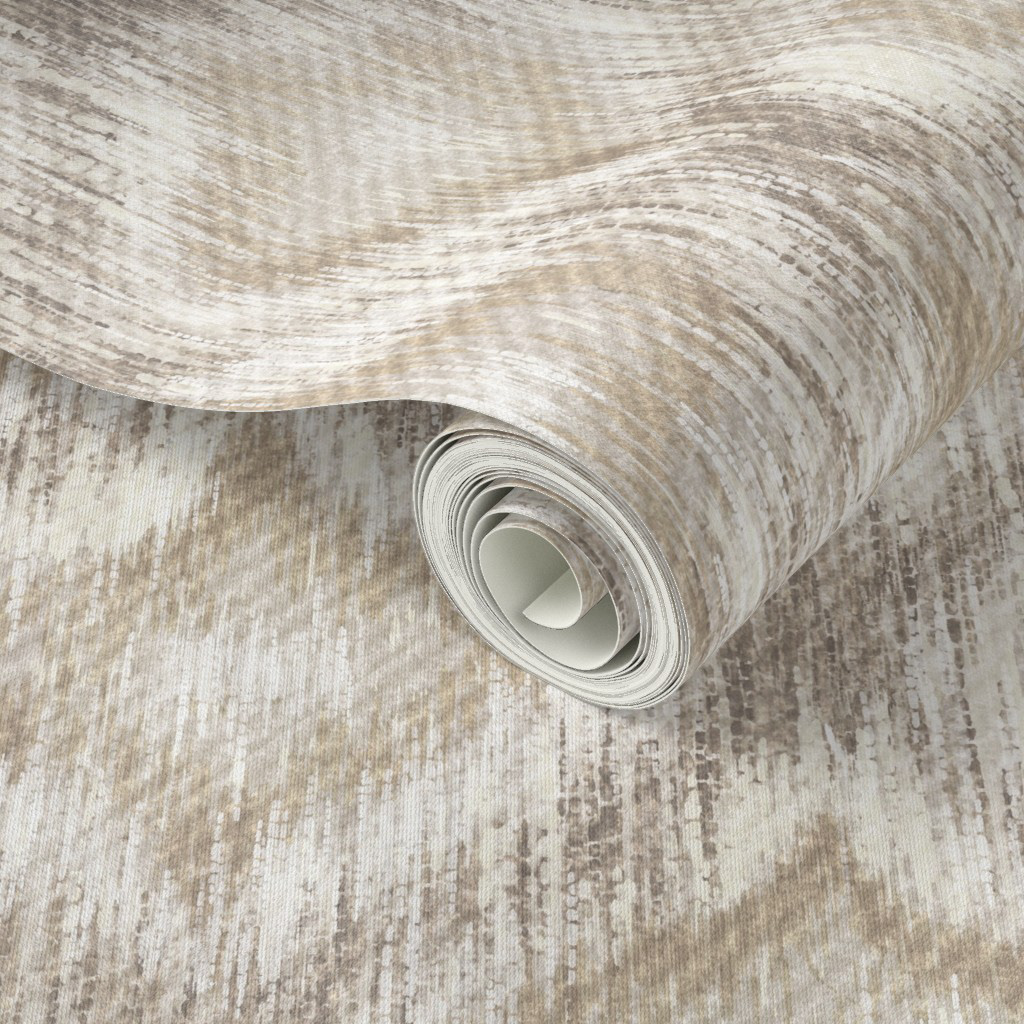 Rolled wallpaper in natural cream ikat ogee pattern, showing the soft warm ground and tonal ogee repeat with diffused hand-crafted edges