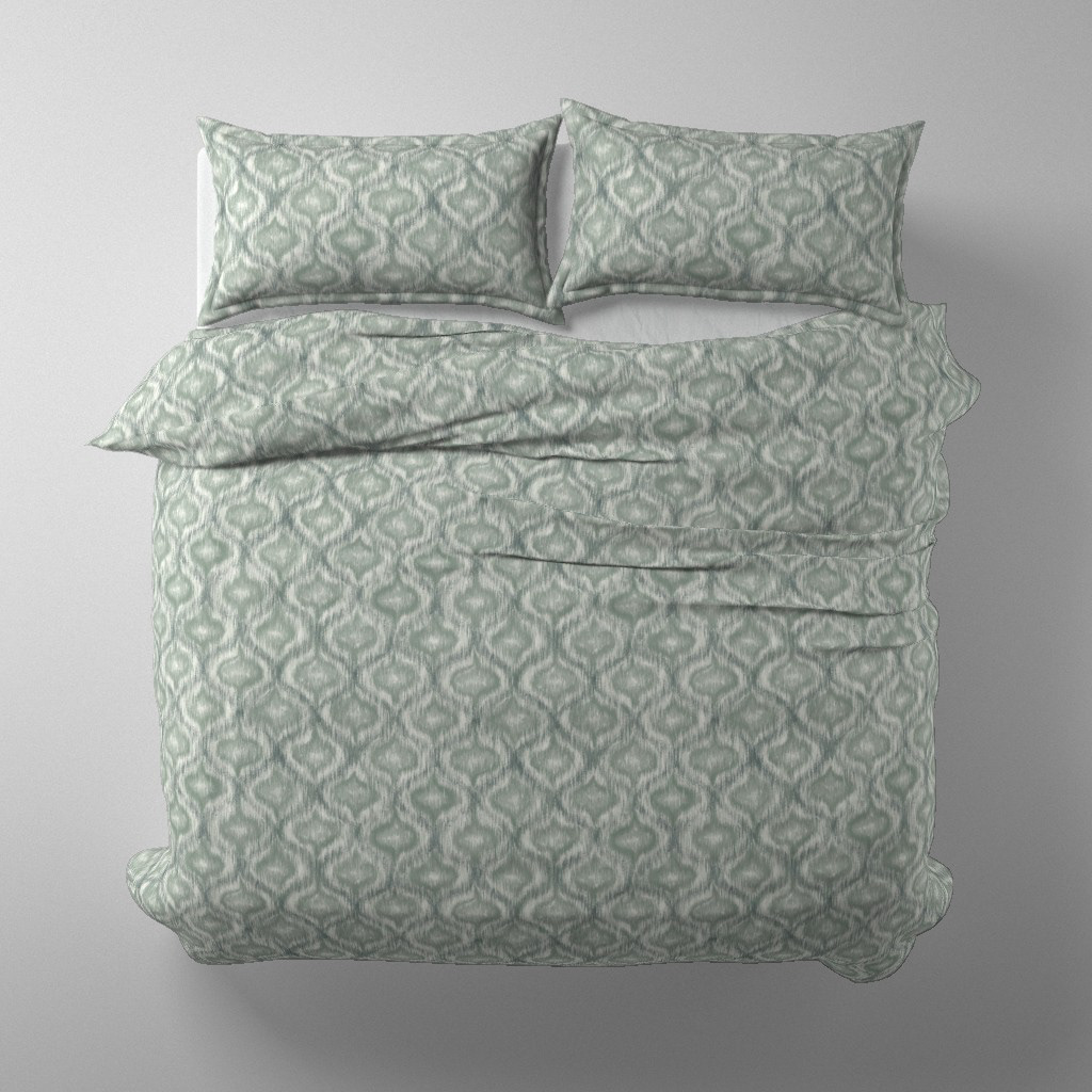 Duvet cover and pillow set mockup in Boho Style Ikat Ogee dusty teal colourway on a styled bed, by Lemon Dessin