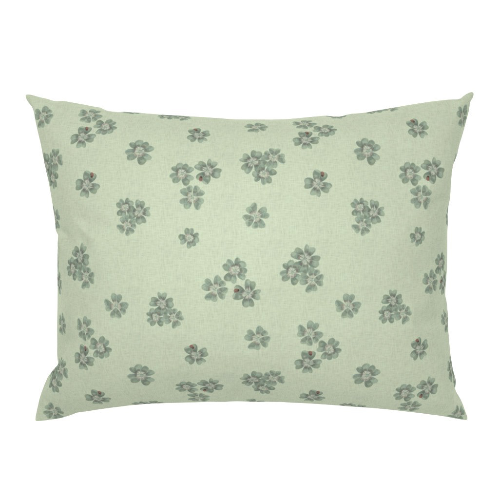 Square cushion cover in Clover Scatter sage green colourway with tonal botanical scatter print, on a white background