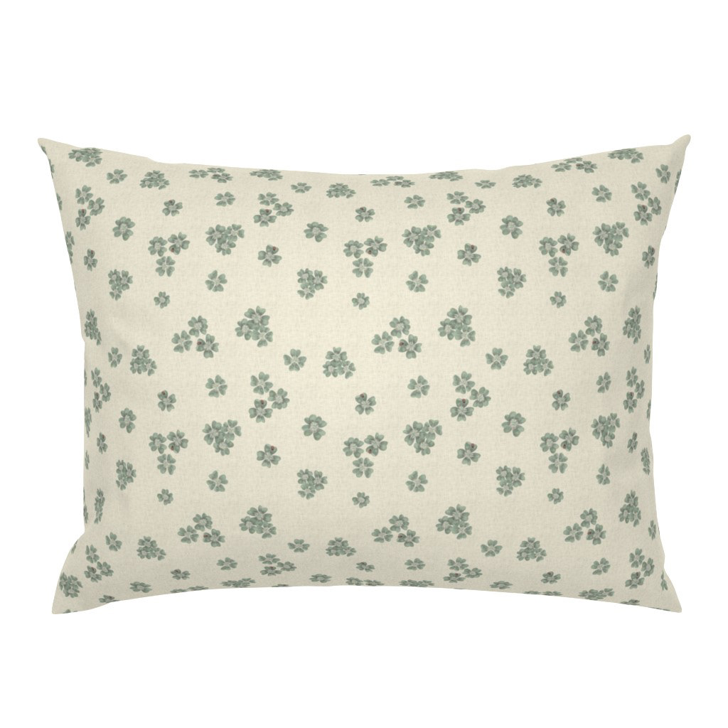 Pillowcase in Clover Scatter cream colourway with scattered sage green clover motif, on a white background