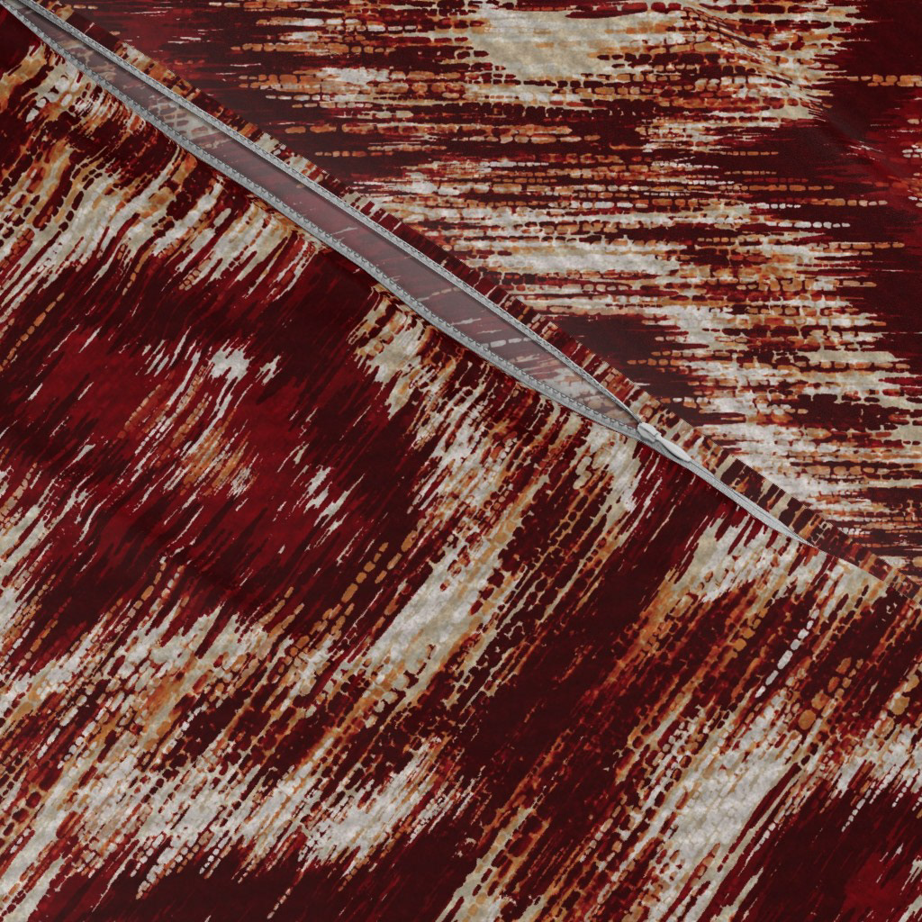 Close-up texture detail of Boho Style Ikat Ogee fabric in rust red showing the soft diffused ikat edges and woven texture