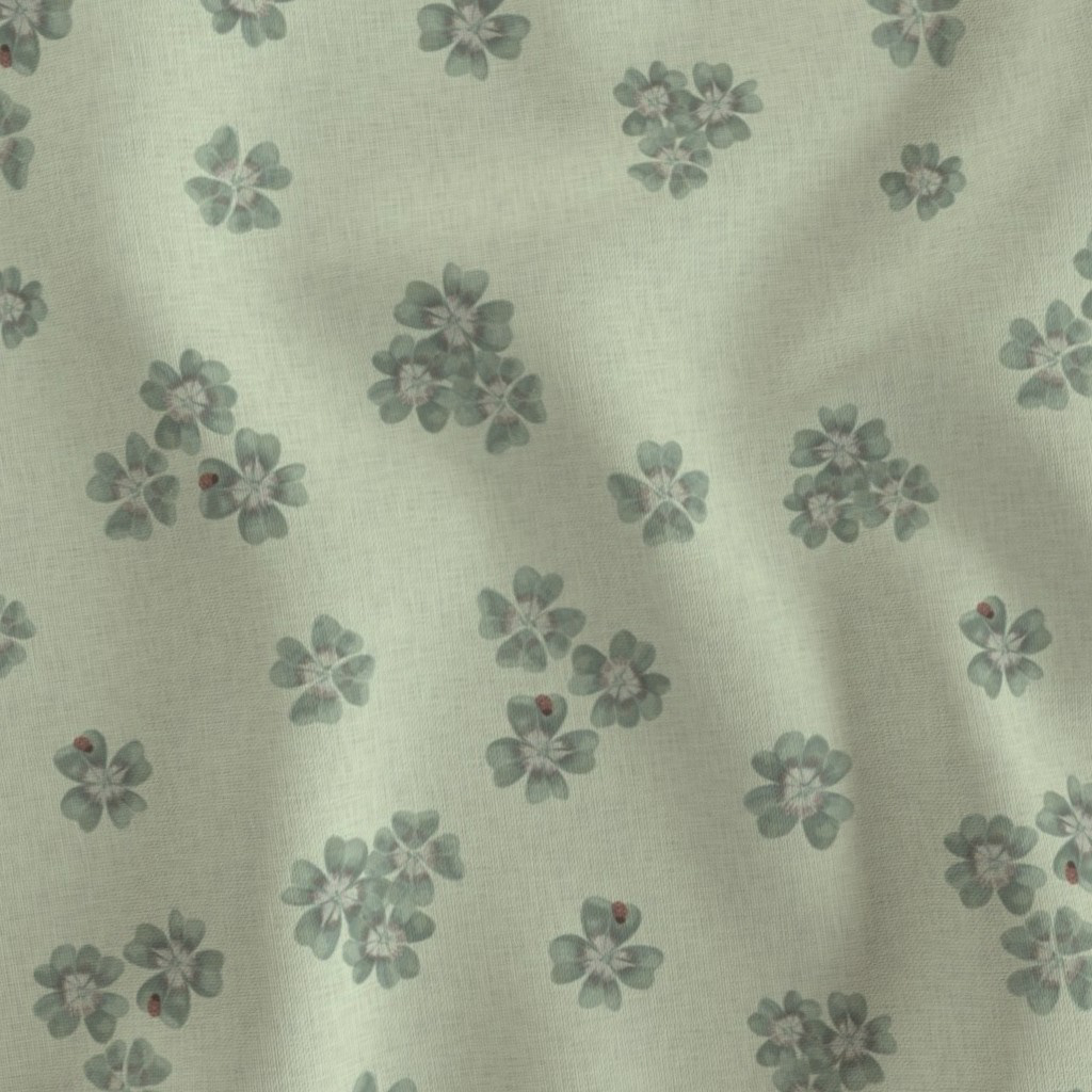 Flat fabric swatch showing Clover Scatter repeat pattern in sage green colourway, tonal botanical print on sage ground