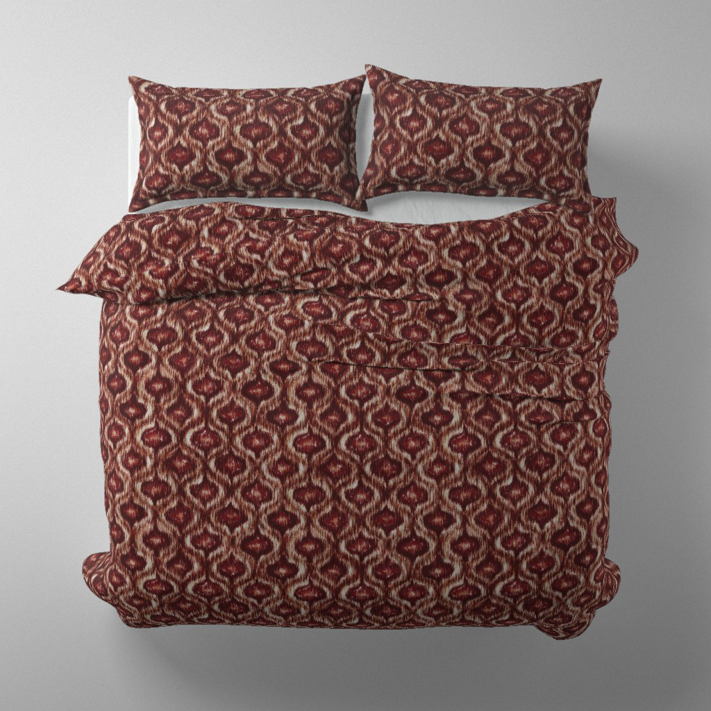 Duvet cover and pillow set mockup in Boho Style Ikat Ogee rust red colourway on a styled bed, by Lemon Dessin