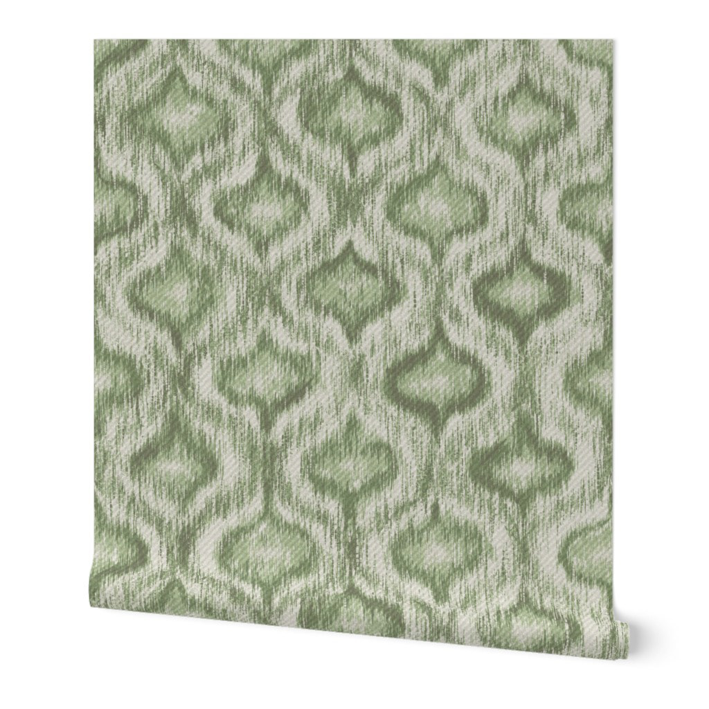 Flat pattern swatch of sage green boho ikat ogee wallpaper with warm tonal variation and hand-crafted ikat texture across the allover ogee motif