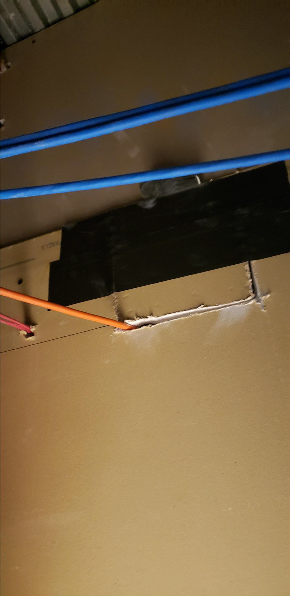 holding the cutout sheetrock back inplace with gaffing tape