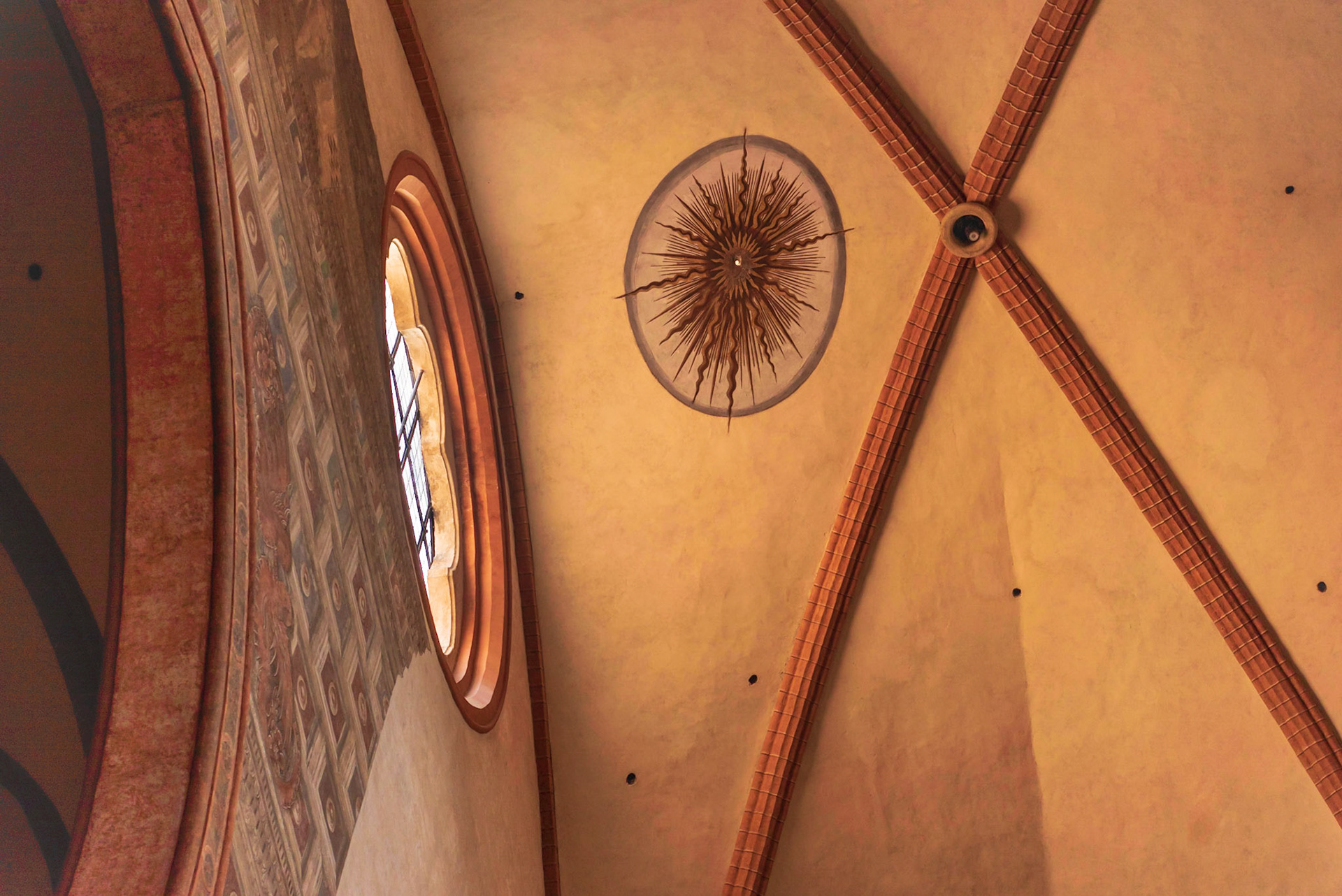 Sun  shines through the ceiling opening and tracks along the cathedral floor to a spot indicating the summer solstice.