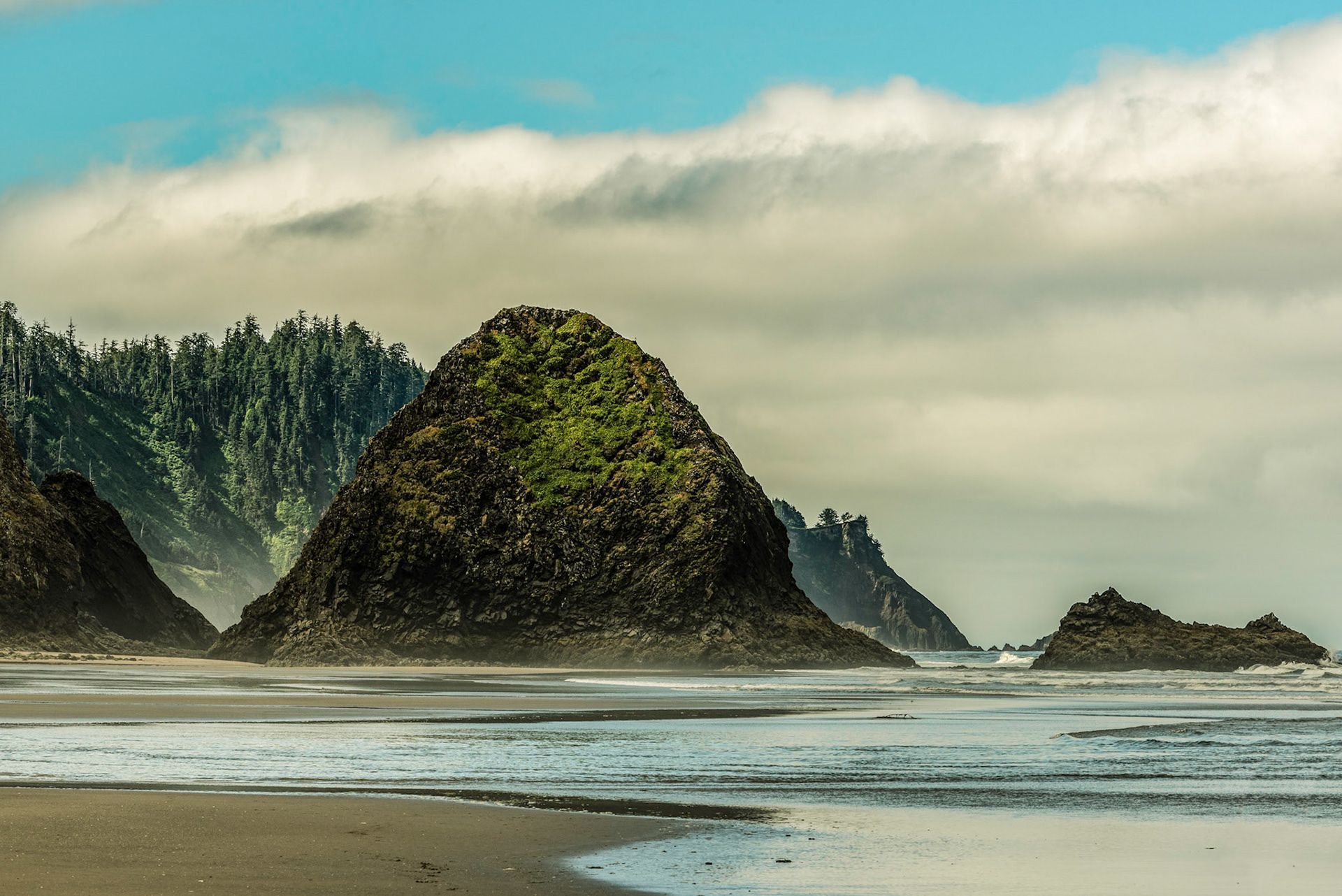Low tide view of the shoreline of Arch Cape looking south