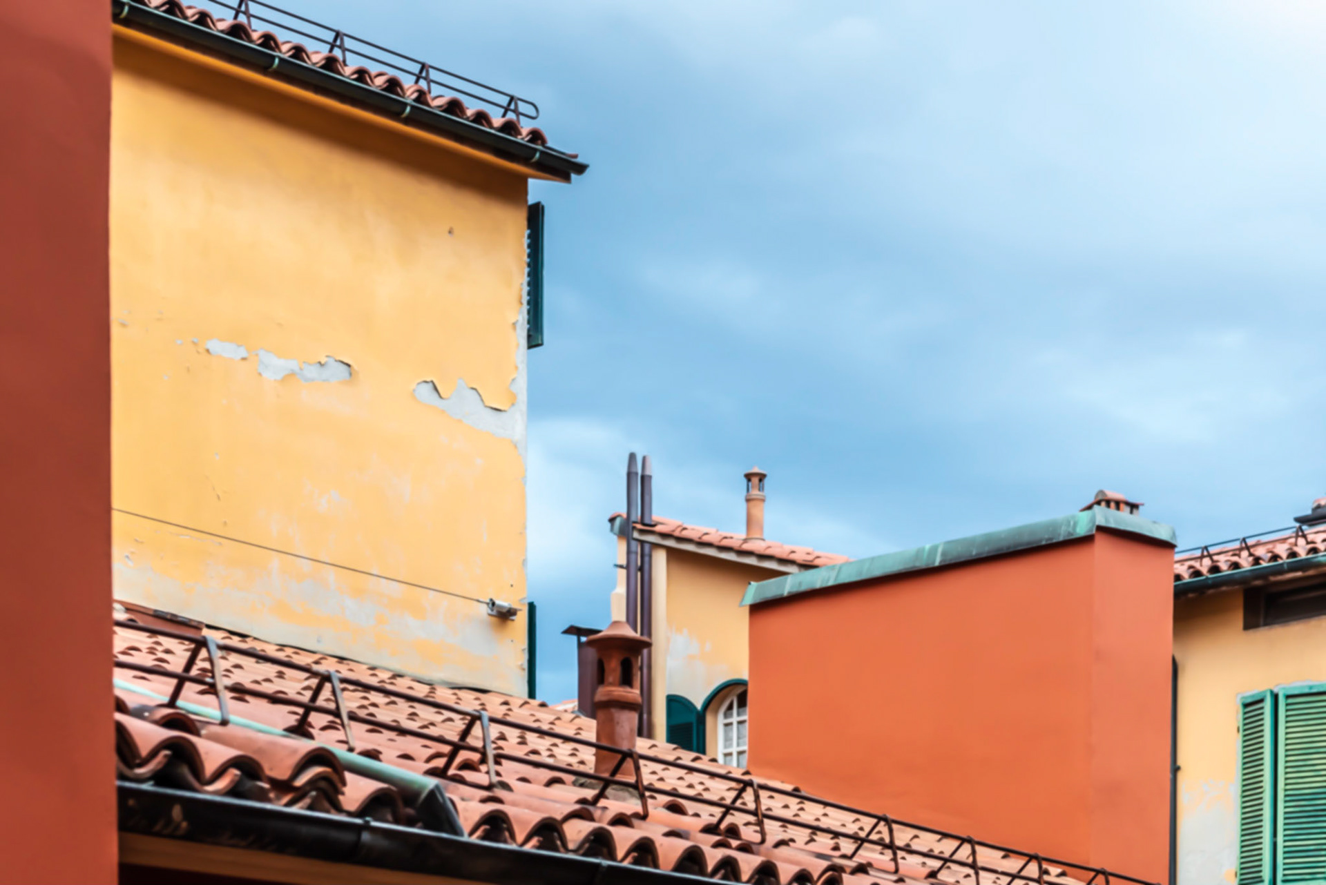 Residences painted with the typical color scheme of the Bologna area