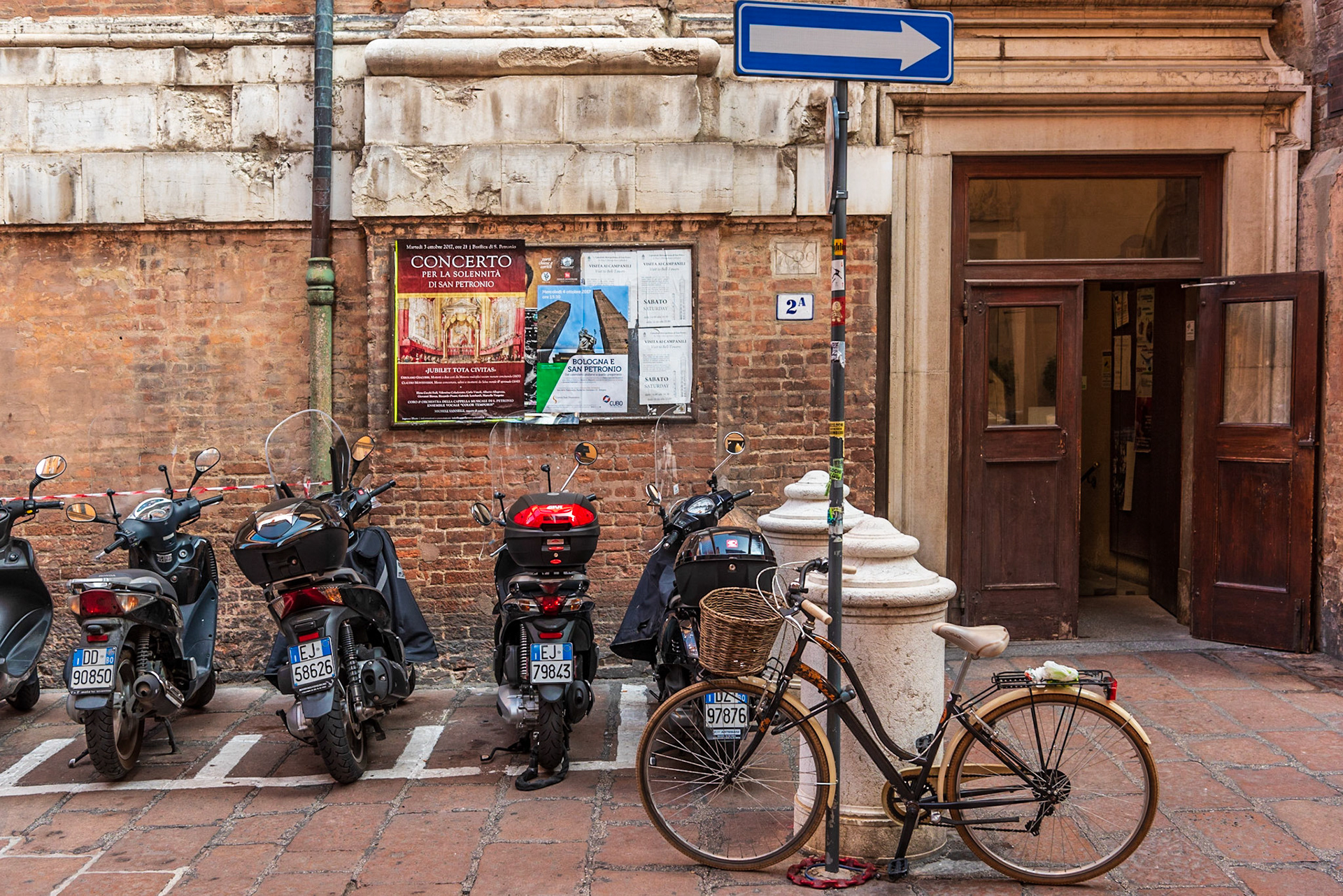 Bologna office area with alley way parking for motorcycles and scooters.