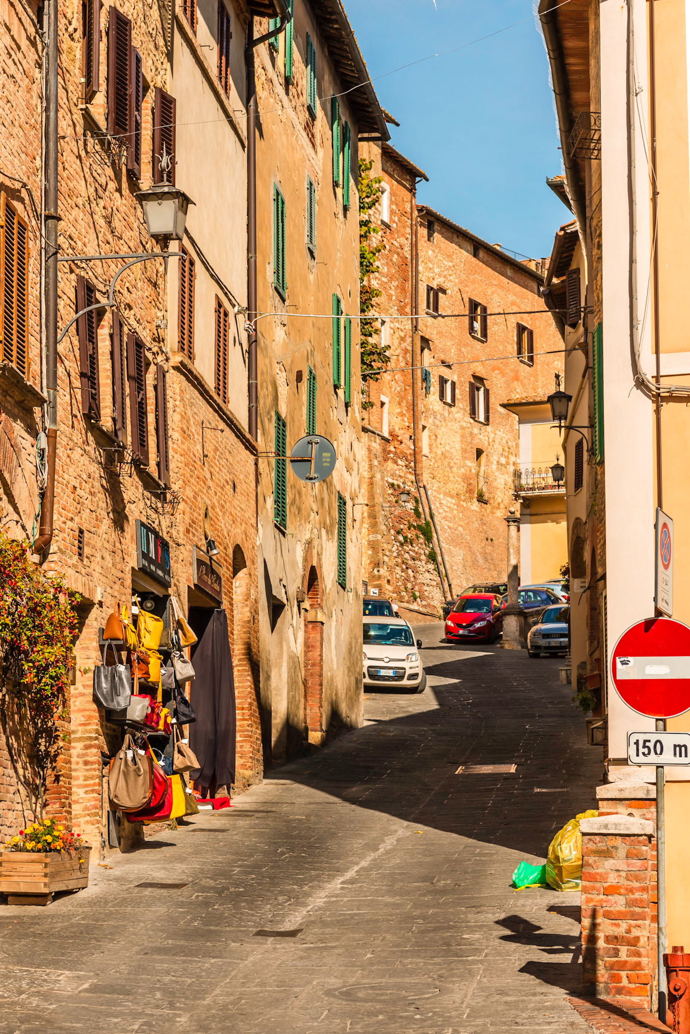 Local Tuscan street with combination of homes and shoppes