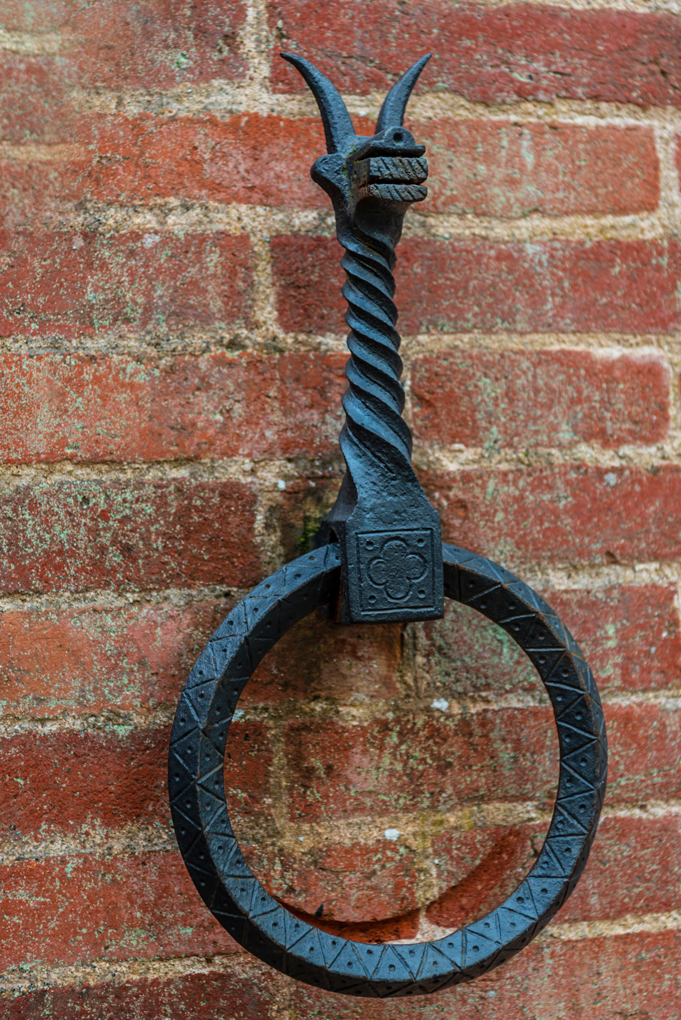 Horse reins tie-down on the wall of a villa near the building's entrance