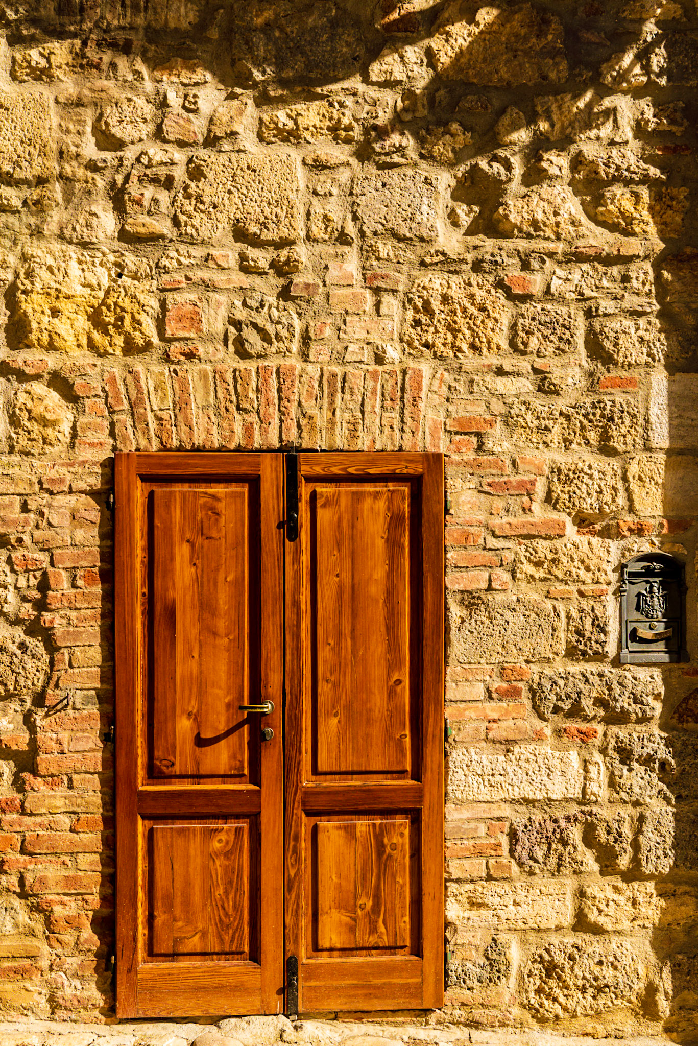 Entry door to a family's residence in Tuscany