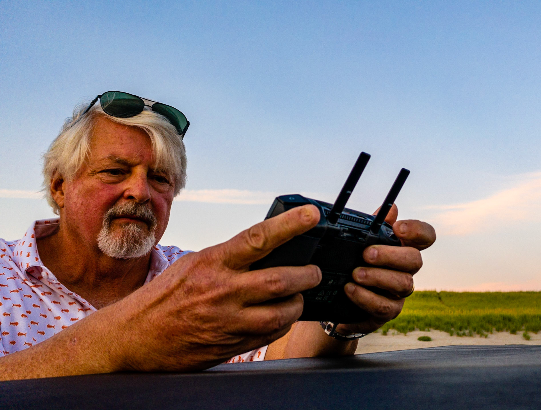 Self-portrait -flying drone and taking pimages at sunset above Del Rey Beach, OR