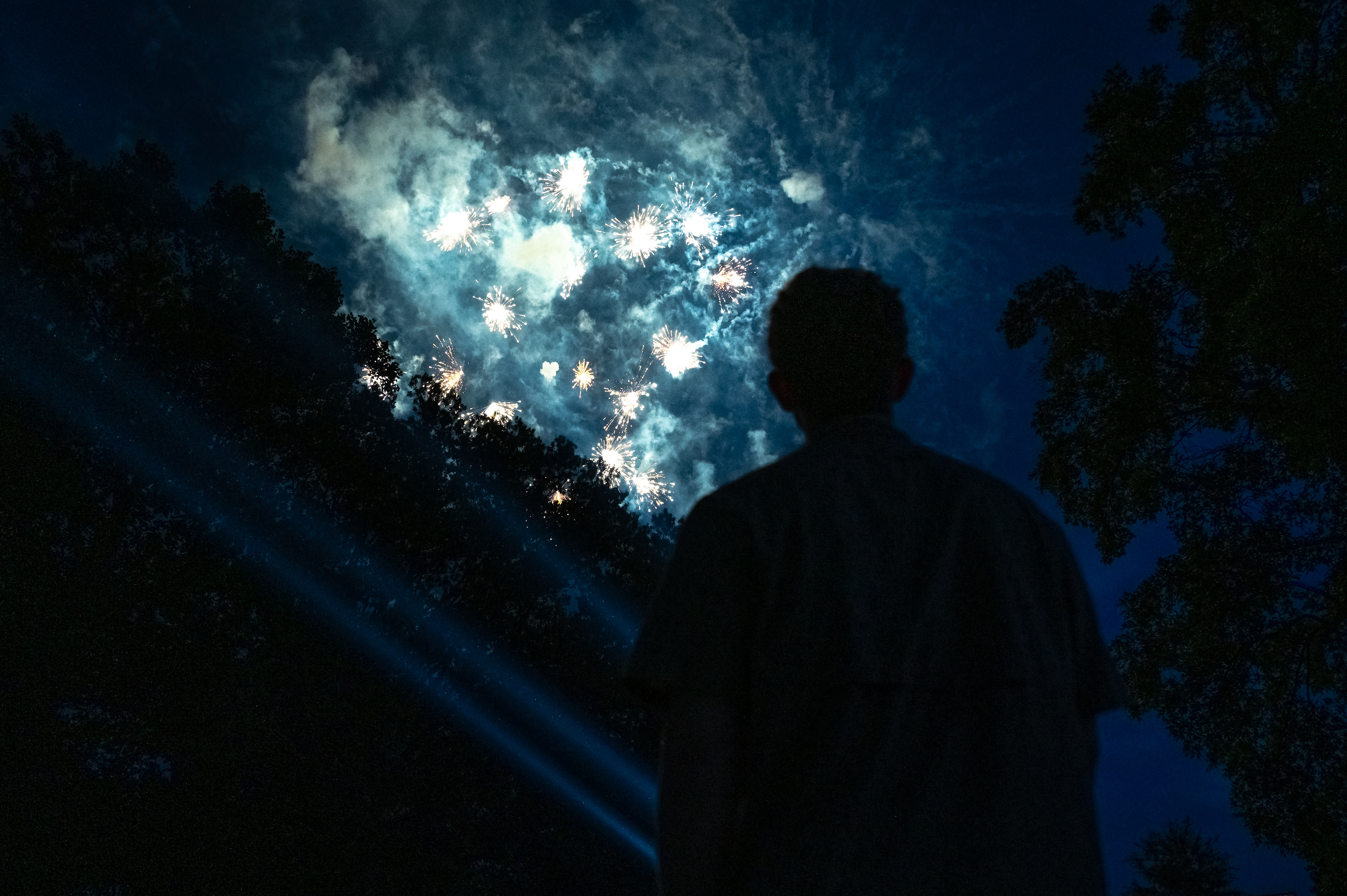 U.S. Air Force A1C Garrett Stimson, 333rd Fighter Generation Squadron avionics technician, watches fireworks during the annual Independence Day Celebration at Seymour Johnson Air Force Base, North Carolina, June 27, 2025. The event celebrated the nation’s 249th birthday and honored the freedom defended by service members past and present.