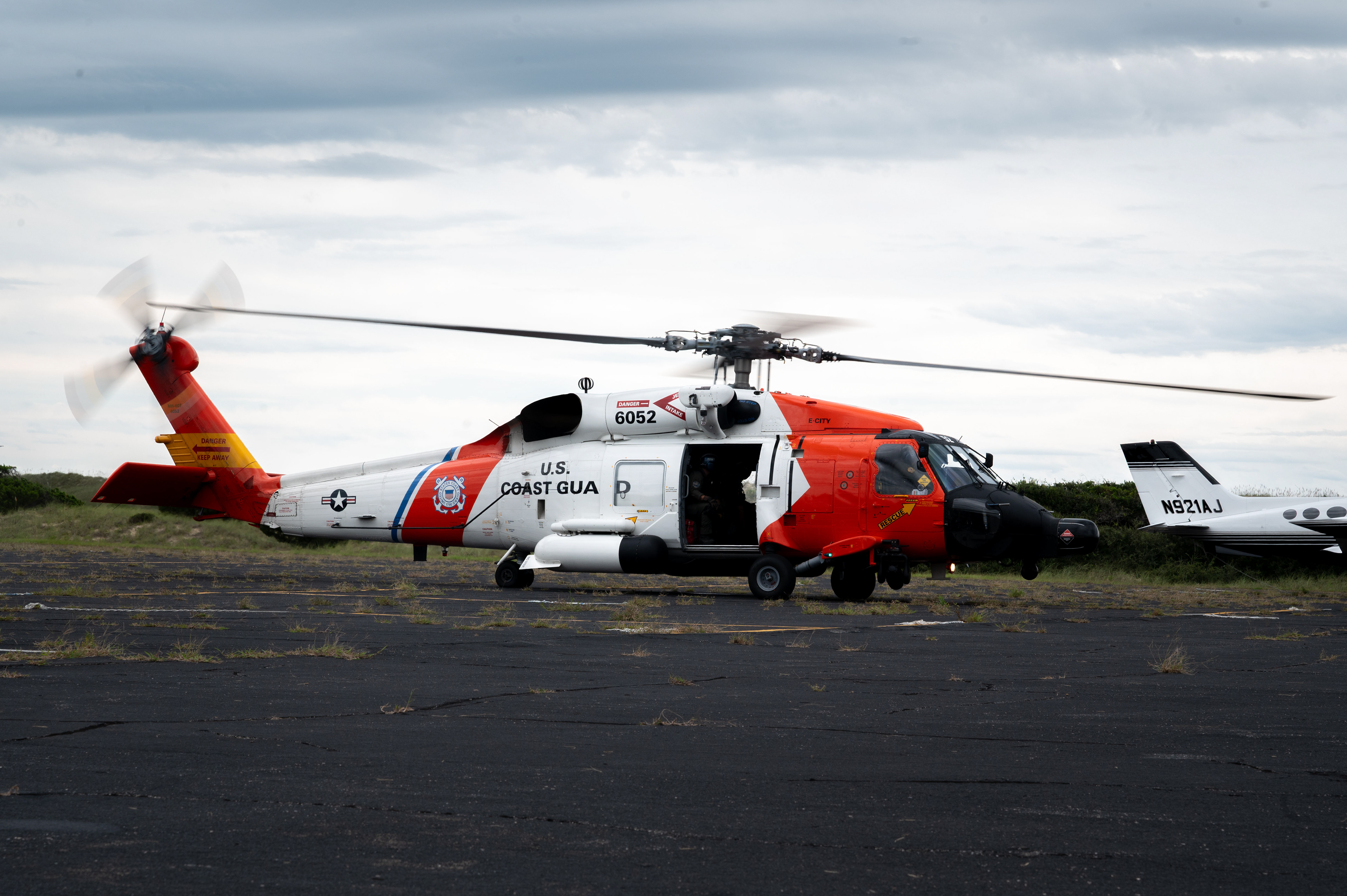 A U.S. Coast Guard MH-60T Jayhawk helicopter takes flight during a search-and-rescue exercise over Cape Hatteras, North Carolina, Aug. 28, 2025. The sortie demonstrated the helicopter’s role in supporting hoist operations and coastal recovery missions. 